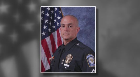 HILLIARD OFFICER WITH BACKGROUND_127740
