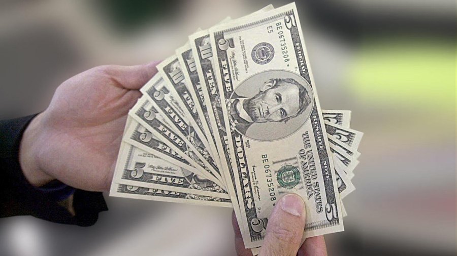 generic-hands-holding-cash-money_276249