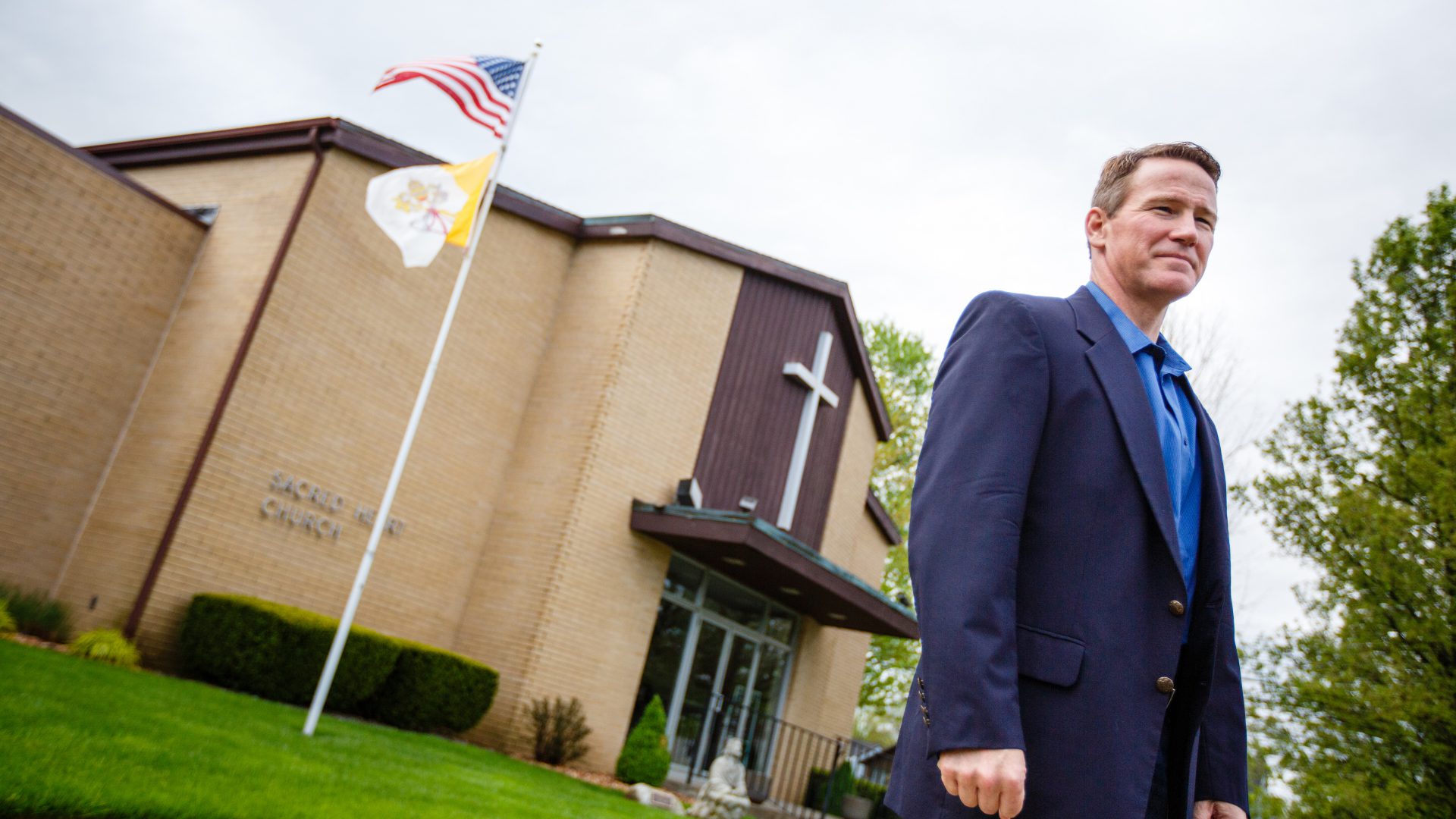 Jon Husted in front of his childhood church, Sacred Heart Church of Montpelier_298905