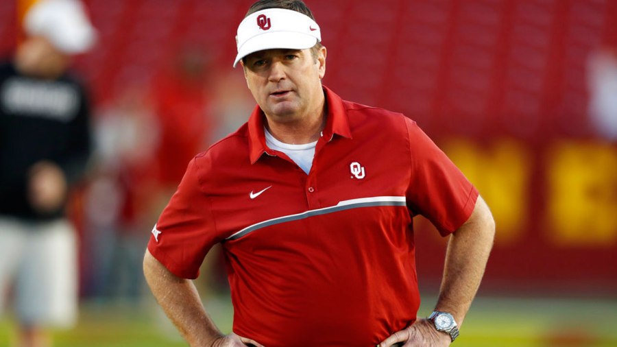 FILE - In this Nov. 3, 2016, file photo, Oklahoma head coach Bob Stoops stands on the field before an NCAA college football game against Iowa S_316764