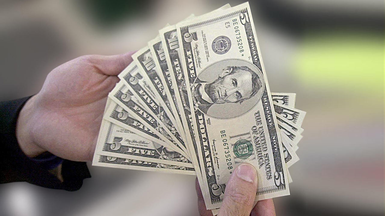 generic-hands-holding-cash-money_276249
