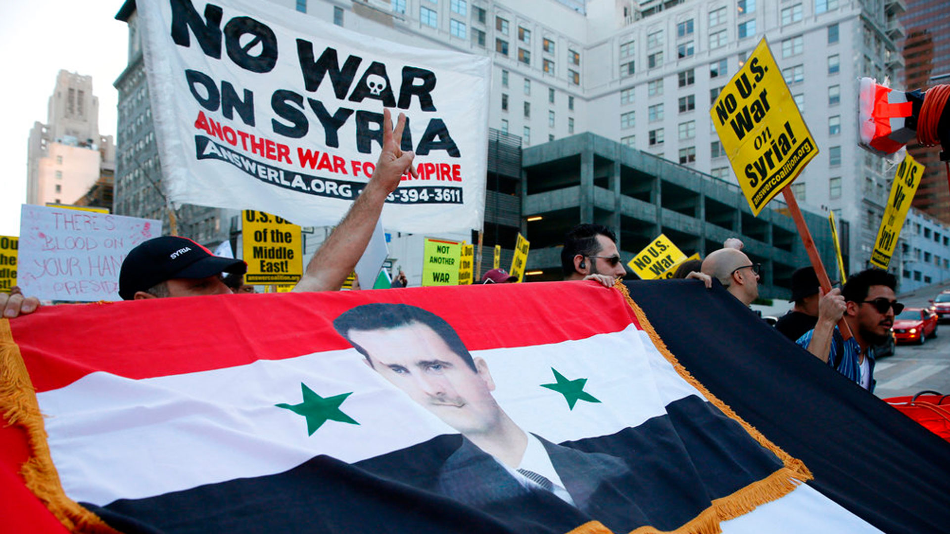 syria-bombing-protest_1523783847754.jpg
