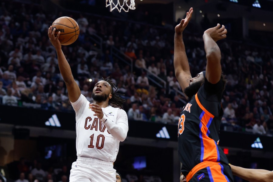 Cleveland Cavaliers guard Darius Garland (10) shoots against New York Knicks center Mitchell Robinson during the first half of Game 2 of an NBA basketball first-round playoff series Tuesday, April 18, 2023, in Cleveland. (AP Photo/Ron Schwane)