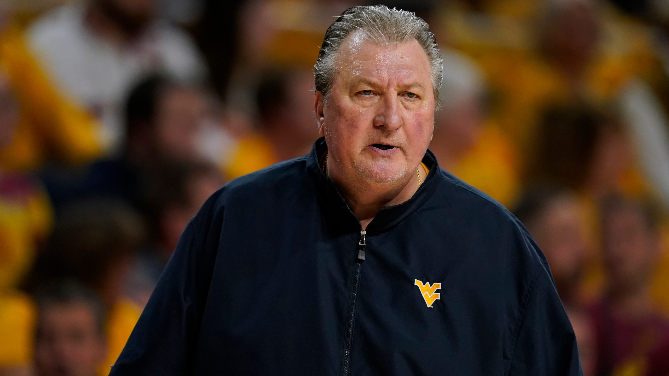 FILE - West Virginia head coach Bob Huggins watches from the bench during the first half of an NCAA college basketball game against Iowa State, Monday, Feb. 27, 2023, in Ames, Iowa. Huggins has been arrested on suspicion of drunken driving, Friday, June 16, a month after the university suspended him for three games for using an anti-gay slur while also denigrating Catholics during a radio interview. (AP Photo/Charlie Neibergall, File)