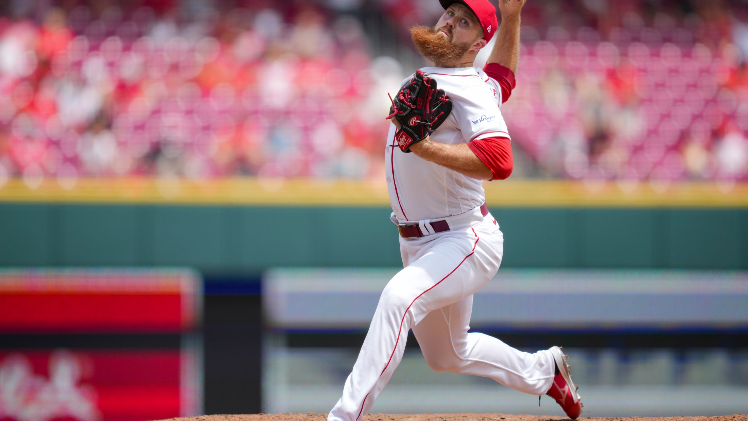 Cincinnati Reds' Buck Farmer throws during the ninth inning of a baseball game against the Colorado Rockies in Cincinnati, Wednesday, June 21, 2023. (AP Photo/Aaron Doster)