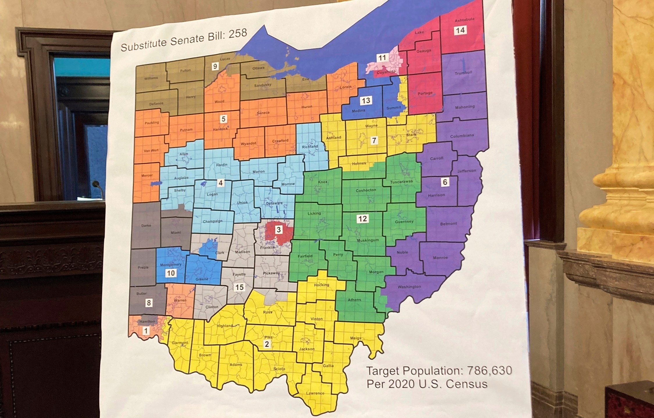 FILE - A map of Ohio congressional districts is displayed during a committee hearing at the Ohio Statehouse in Columbus, Ohio, on Nov. 16, 2021. The Ohio Attorney General's Office has rejected petition language for a constitutional amendment aimed at remaking Ohio’s troubled political-mapmaking system. Republican Dave Yost said Wednesday, Aug. 23, 2023, that the submission, by the group Citizens Not Politicians, failed to present a fair and truthful summary of what is proposed. (AP Photo/Julie Carr Smyth, File)