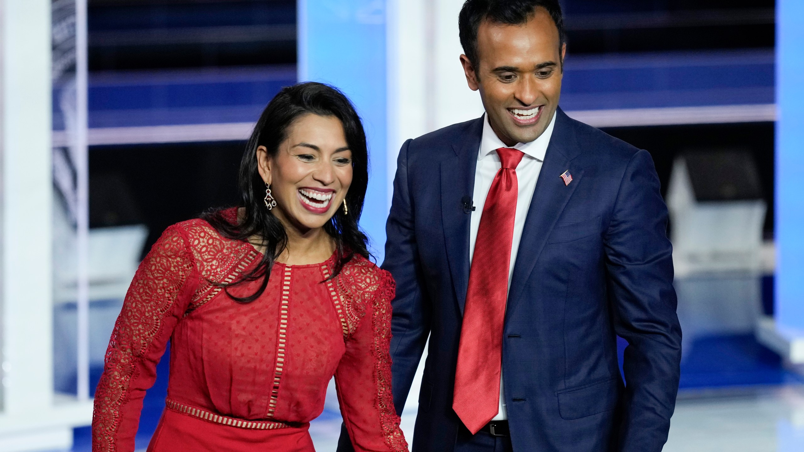 FILE - Republican presidential candidate businessman Vivek Ramaswamy and his wife Apoorva walks on stage after a Republican presidential primary debate hosted by NBC News, Nov. 8, 2023, at the Adrienne Arsht Center for the Performing Arts of Miami-Dade County in Miami. Ramaswamy's presidential campaign has seemingly mirrored his meteoric rise as a biotech entrepreneur. The political novice from Ohio has taken the route of a self-described outsider.(AP Photo/Rebecca Blackwell, File)