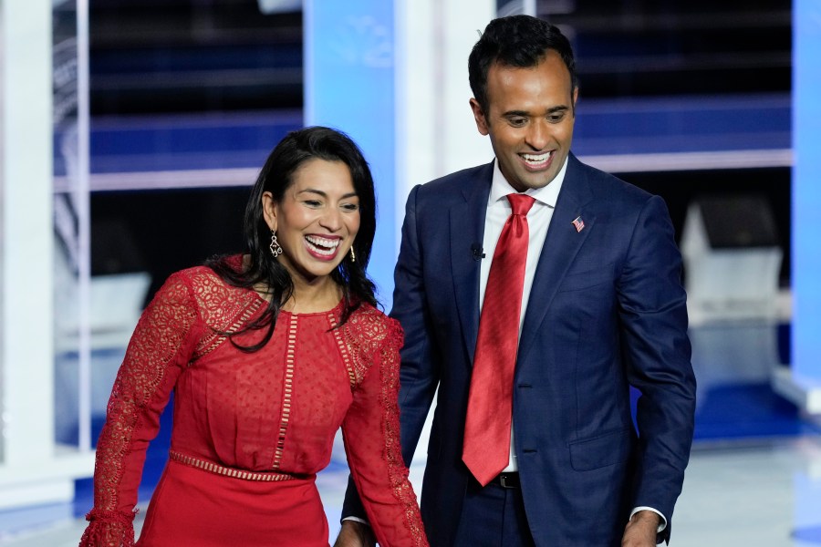 FILE - Republican presidential candidate businessman Vivek Ramaswamy and his wife Apoorva walks on stage after a Republican presidential primary debate hosted by NBC News, Nov. 8, 2023, at the Adrienne Arsht Center for the Performing Arts of Miami-Dade County in Miami. Ramaswamy's presidential campaign has seemingly mirrored his meteoric rise as a biotech entrepreneur. The political novice from Ohio has taken the route of a self-described outsider.(AP Photo/Rebecca Blackwell, File)