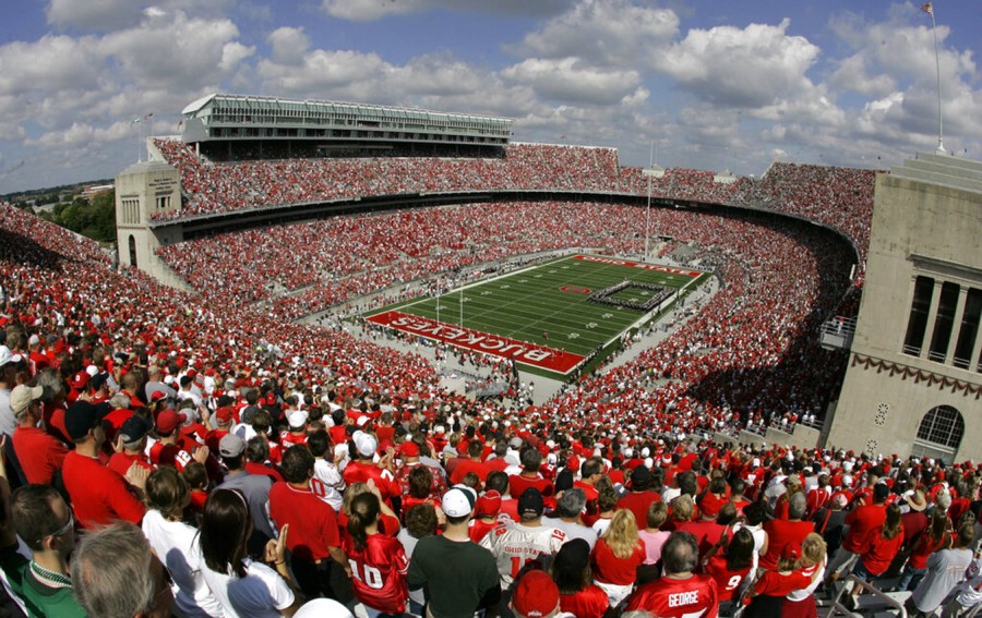 Fans cheer as the Ohio State marching band performs before an NCAA college football game against Ohio Saturday, Sept. 6, 2008 in Columbus, Ohio. (AP Photo/Kiichiro Sato)