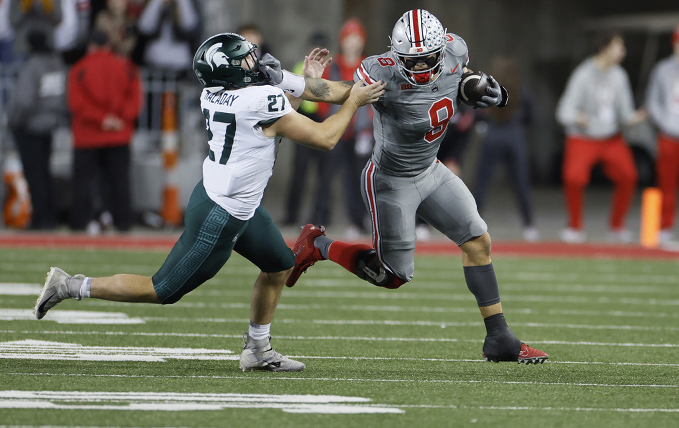 Ohio State tight end Cade Stover, right, stiff-arms Michigan State linebacker Cal Haladay during the first half of an NCAA college football game Saturday, Nov. 11, 2023, in Columbus, Ohio. (AP Photo/Jay LaPrete)