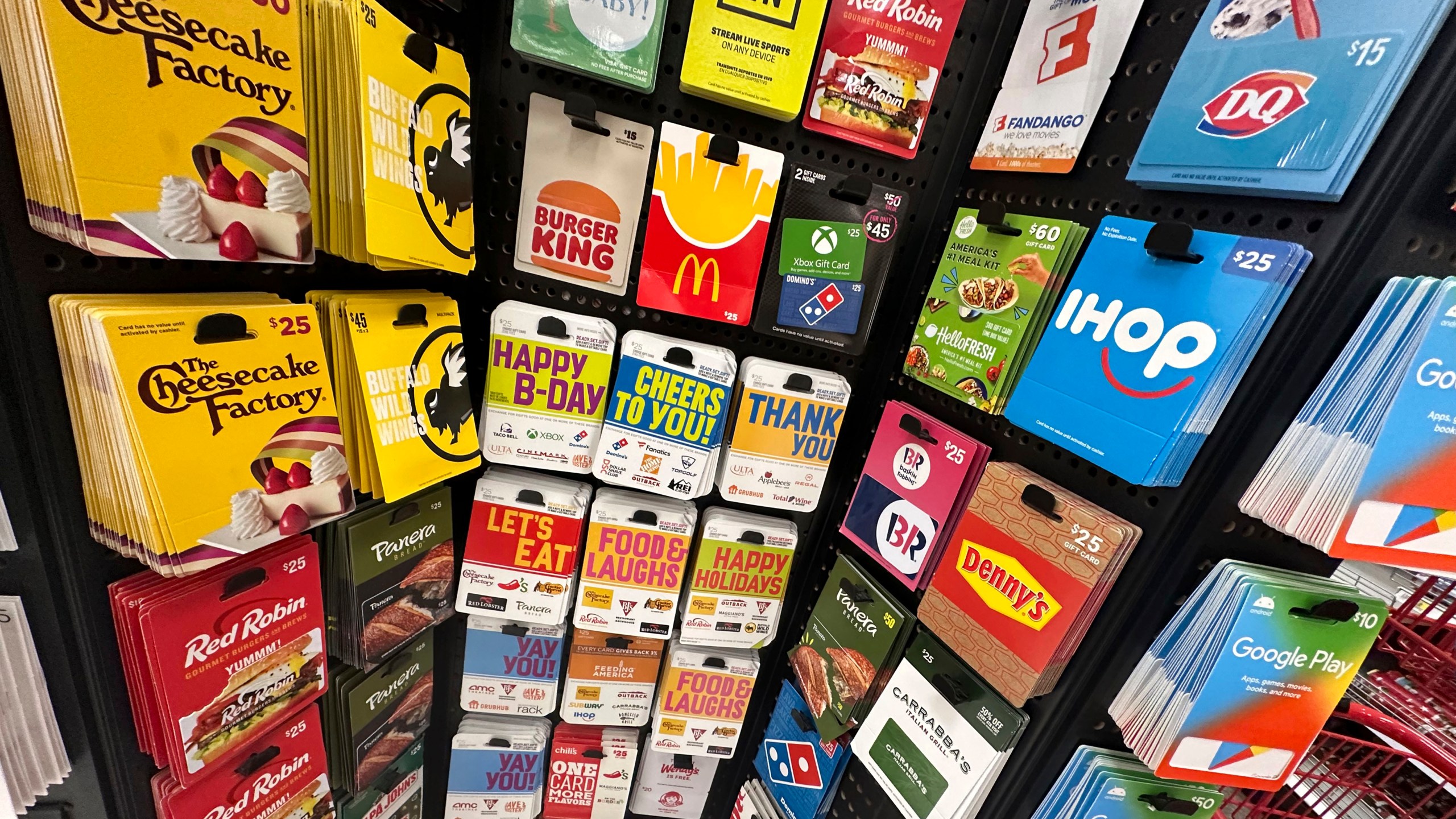 Gift cards are displayed at a Target store, in New York, Thursday, Dec. 21, 2023. Americans are expected to spend nearly $30 billion on gift cards this holiday season, according to the National Retail Federation. Restaurant gift cards are the most popular, making up one-third of those sales. (AP Photo/Richard Drew)