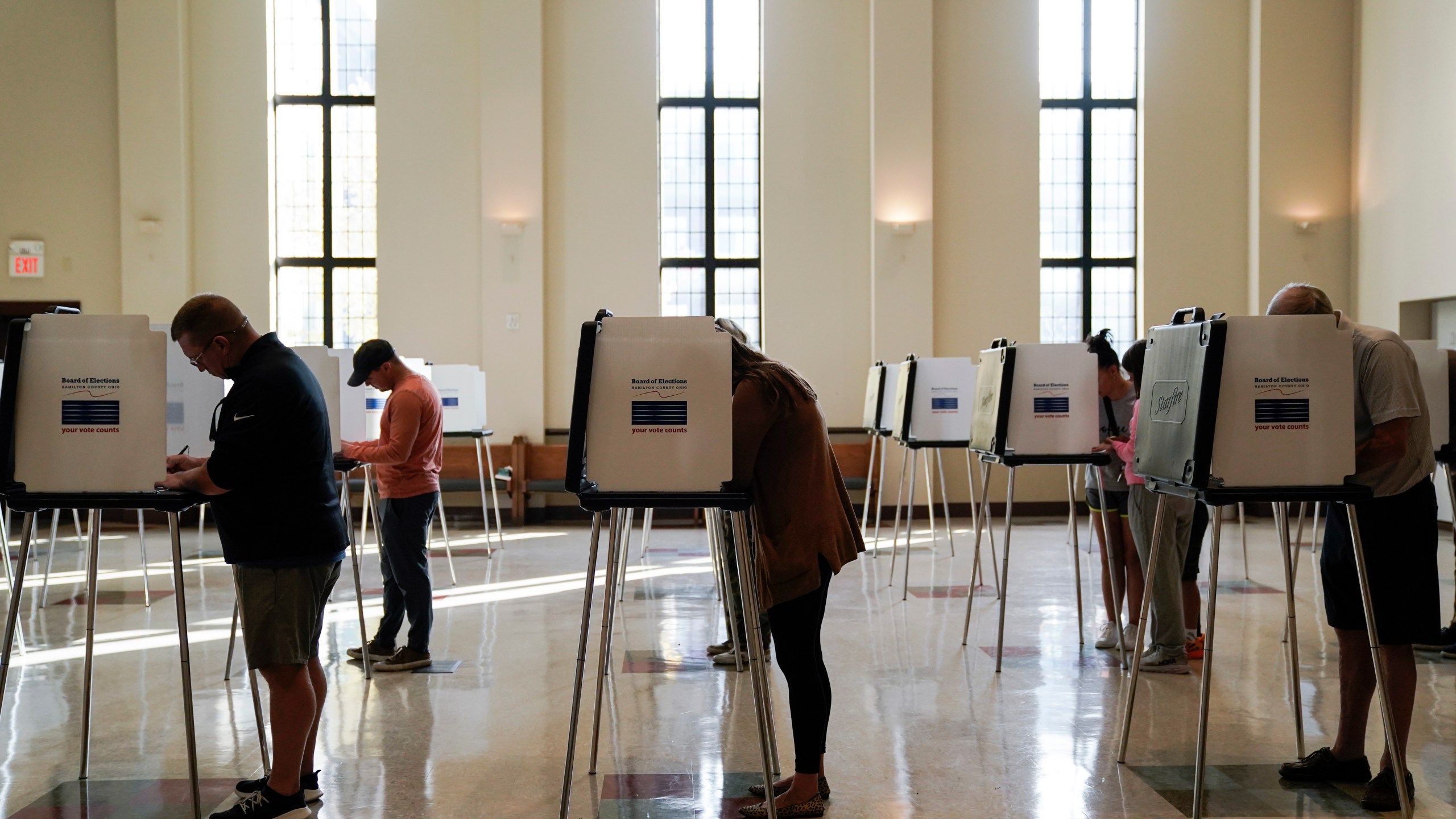 FILE - People vote on Election Day, Nov. 7, 2023, at Knox Presbyterian Church in Cincinnati. On Monday, Jan. 8, 2024, a federal judge upheld as constitutional provisions of the sweeping election law that Ohio put in place last year, rejecting a Democratic law firm's challenge to strict new photo ID requirements, dropbox restrictions and tightened deadlines related to absentee and provisional ballots. (AP Photo/Joshua A. Bickel, File)