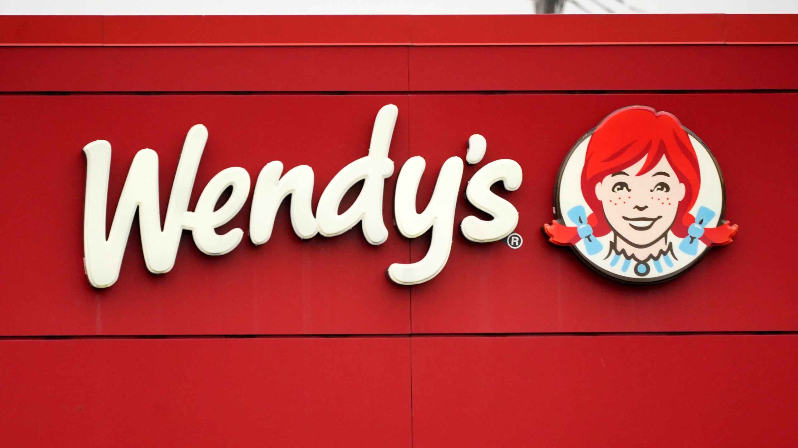 FILE - The Wendy's sign is seen at a restaurant, Jan. 23, 2023, in Pittsburgh. On Thursday, Jan. 18, 2024, Wendy’s Co. named Kirk Tanner, a longtime PepsiCo executive, as its new CEO. (AP Photo/Gene J. Puskar, File)