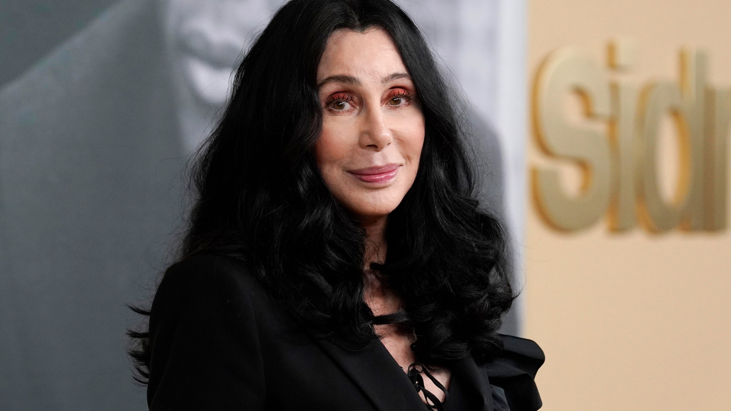 FILE - Cher poses at the premiere of the documentary film "Sidney," Sept. 21, 2022, in Los Angeles. Cher has filed a petition to become a temporary conservator overseeing her son's money, saying his struggles with mental health and substance abuse have left him unable to manage his assets and potentially put his life in danger. The Oscar and Grammy winning singer and actor on Wednesday, Dec. 27, 2023, filed the petition in Los Angeles Superior Court that would give her temporary control of the finances of Elijah Blue Allman, her 47-year-old son with musician Gregg Allman. (AP Photo/Chris Pizzello, File)