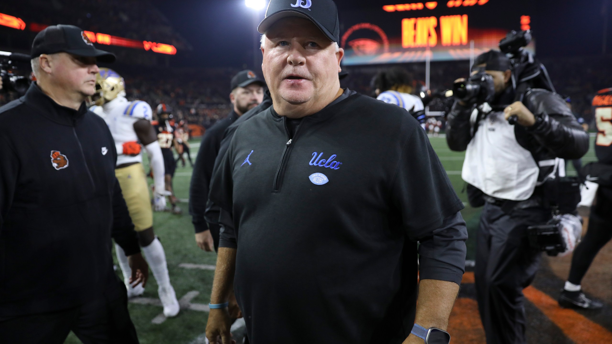 FILE - UCLA coach Chip Kelly walks off the field following the team's NCAA college football game against Oregon State Saturday, Oct. 14, 2023, in Corvallis, Ore. Chip Kelly has informed UCLA officials that he is stepping down as coach of the Bruins, a person with direct knowledge of the decision told The Associated Press on Friday, Feb. 9, 2024. (AP Photo/Amanda Loman, File)