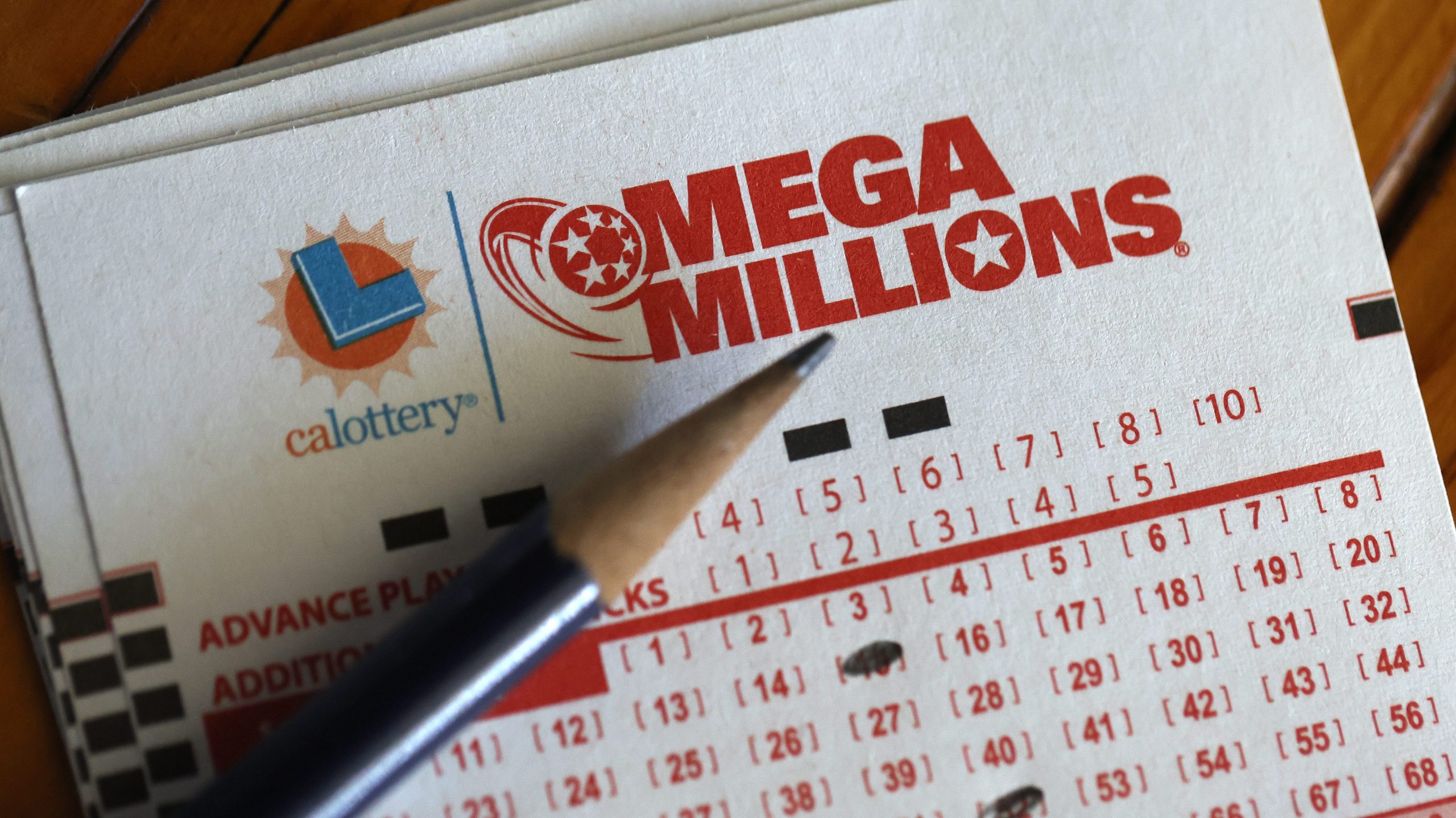Mega Millions lottery tickets are displayed on August 01, 2023 in San Anselmo, California. (Photo Illustration by Justin Sullivan/Getty Images)