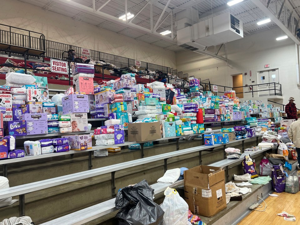 Diapers are stacked inside the gym at Indian Lake High on Saturday, March 16, 2024, in Indian Lake, Logan County, Ohio. The high school has become a donation center after a tornado swept through the Indian Lake area Thursday. in Indian Lake, in Logan County, Ohio. The Indian Lake area in Ohio’s Logan County was one of the hardest hit (AP Photo/Patrick Orsagos)
