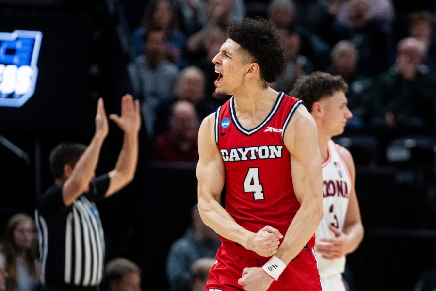 Dayton guard Koby Brea (4) celebrates after making a basket against Arizona during the first half of a second-round college basketball game in the NCAA Tournament in Salt Lake City, Saturday, March 23, 2024. (AP Photo/Isaac Hale)