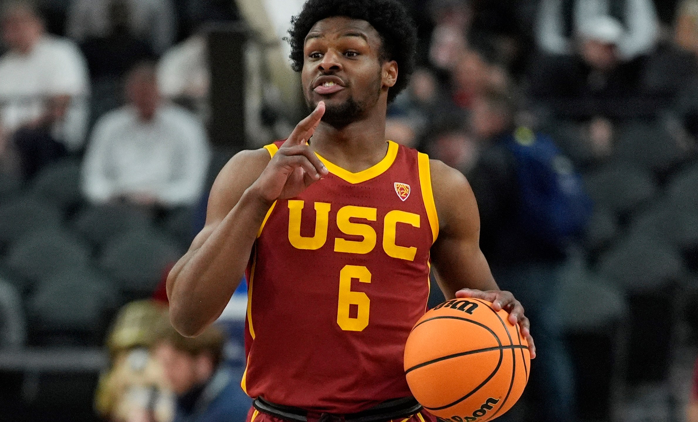 FILE - Southern California's Bronny James (6) drives up the court against Washington during the first half of an NCAA college basketball game in the first round of the Pac-12 tournament Wednesday, March 13, 2024, in Las Vegas. NBA teams were told Monday, May 13, 2024, that Bronny James, the son of the Los Angeles Lakers' LeBron James, has been medically cleared to play in the league and is expected to participate in the draft combine this week, a person with knowledge of the matter told The Associated Press. (AP Photo/John Locher, File)