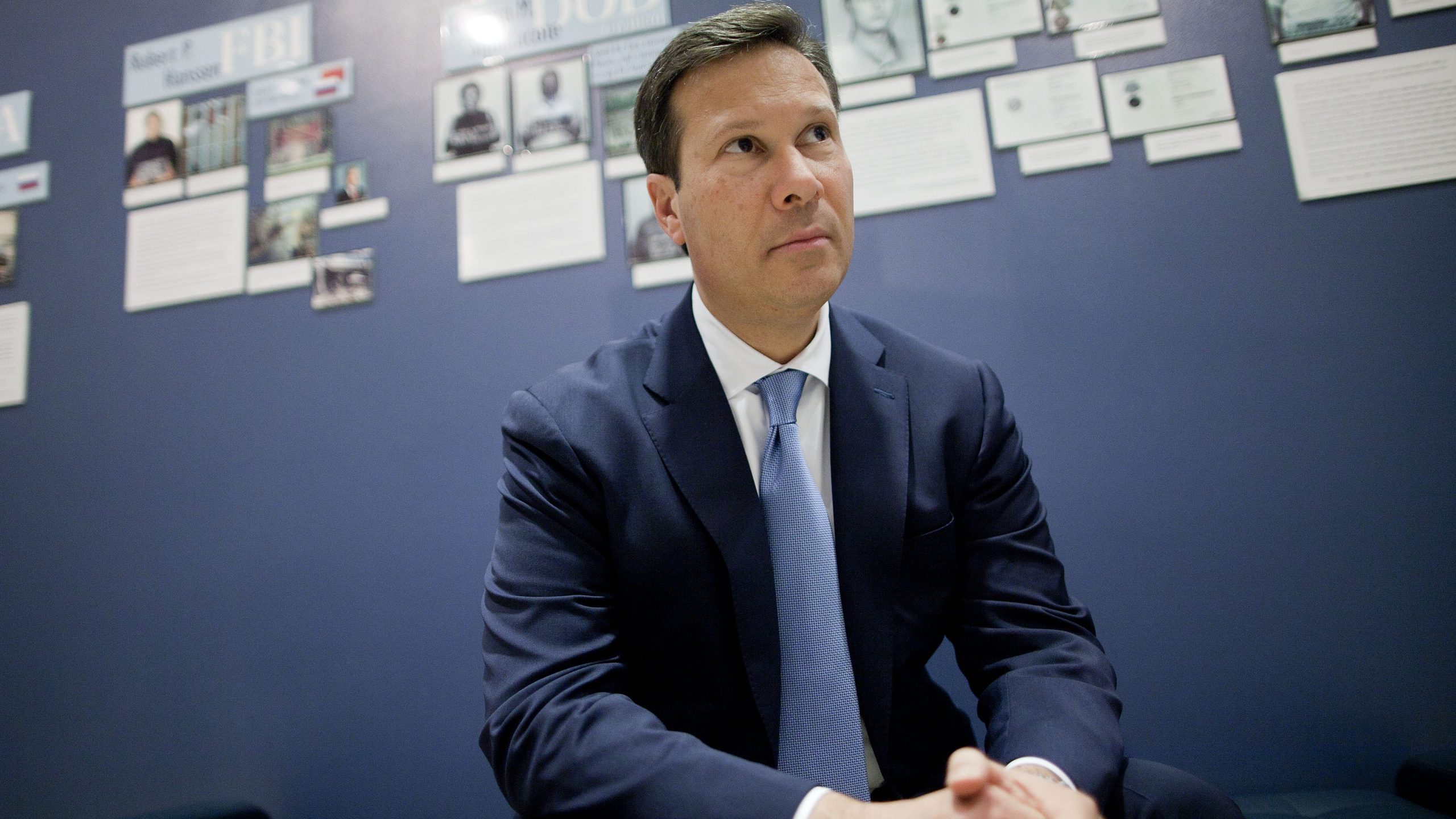 Frank Figliuzzi, assistant director for counterintelligence with the Federal Bureau of Investigation (FBI), sits for a photograph in front of a wall of convicted spy profiles at FBI headquarters in Washington, D.C., U.S., on Thursday, March 29, 2012. While overshadowed by espionage against by foreign countries to penetrate U.S. universities have increased in the past five years, Figliuzzi said. Photographer: Andrew Harrer/Bloomberg via Getty Images