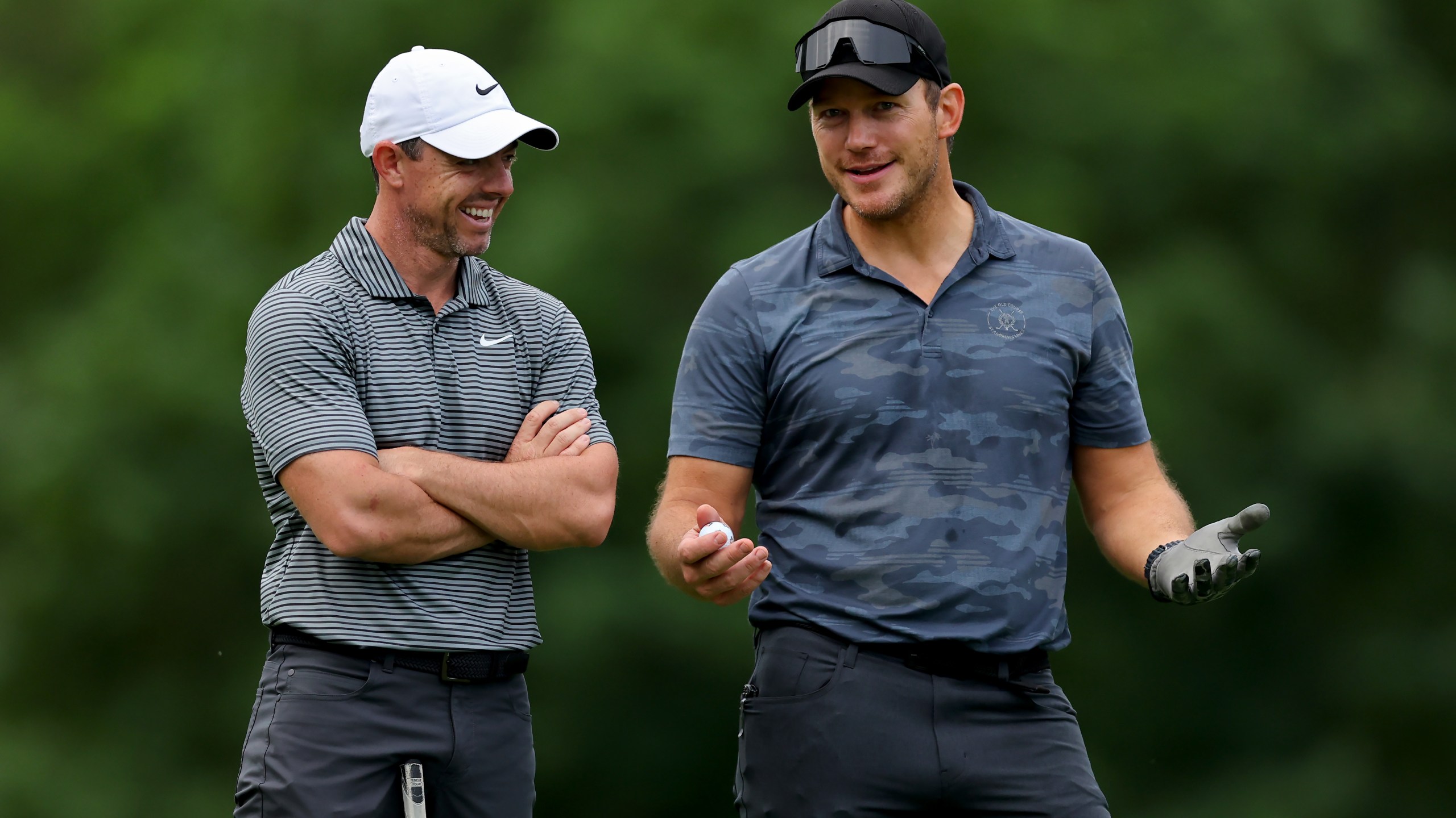 DUBLIN, OHIO - JUNE 05: Rory McIlroy of Northern Ireland (L) and actor Chris Pratt meet on the fourth hole during the Pro Am event prior to the Memorial Tournament presented by Workday at Muirfield Village Golf Club on June 05, 2024 in Dublin, Ohio. (Photo by Michael Reaves/Getty Images)