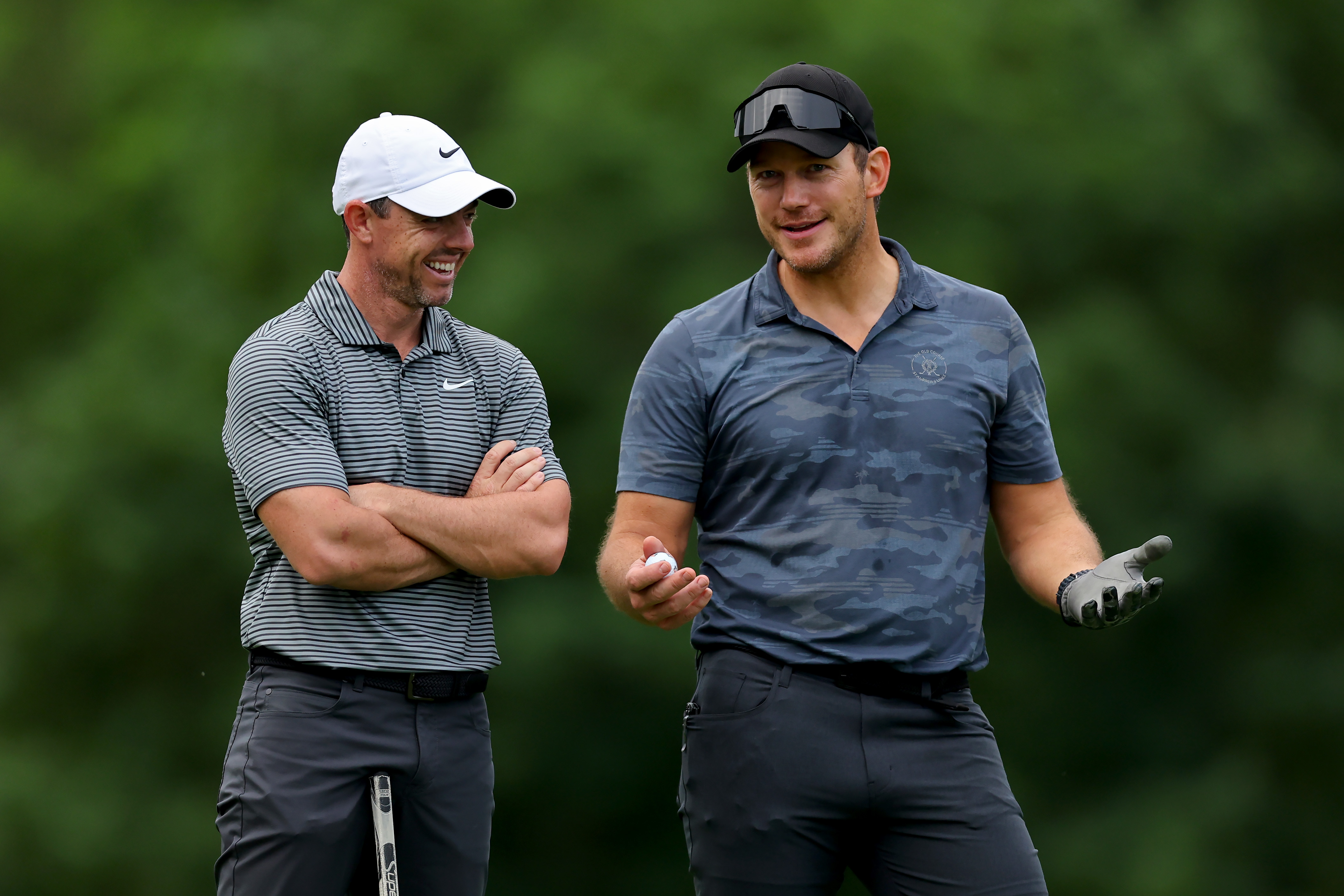 DUBLIN, OHIO - JUNE 05: Rory McIlroy of Northern Ireland (L) and actor Chris Pratt meet on the fourth hole during the Pro Am event prior to the Memorial Tournament presented by Workday at Muirfield Village Golf Club on June 05, 2024 in Dublin, Ohio. (Photo by Michael Reaves/Getty Images)