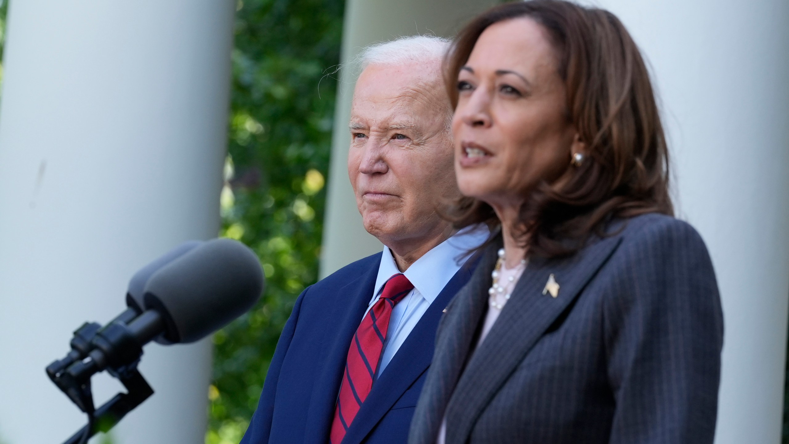 FILE - President Joe Biden listens as Vice President Kamala Harris speaks in the Rose Garden of the White House in Washington, May 13, 2024. With Biden ending his reelection bid and endorsing Harris, Democrats now must navigate a shift that is unprecedented this late in an election year. Democrats are set to hold their convention in Chicago in August. (AP Photo/Susan Walsh, File)