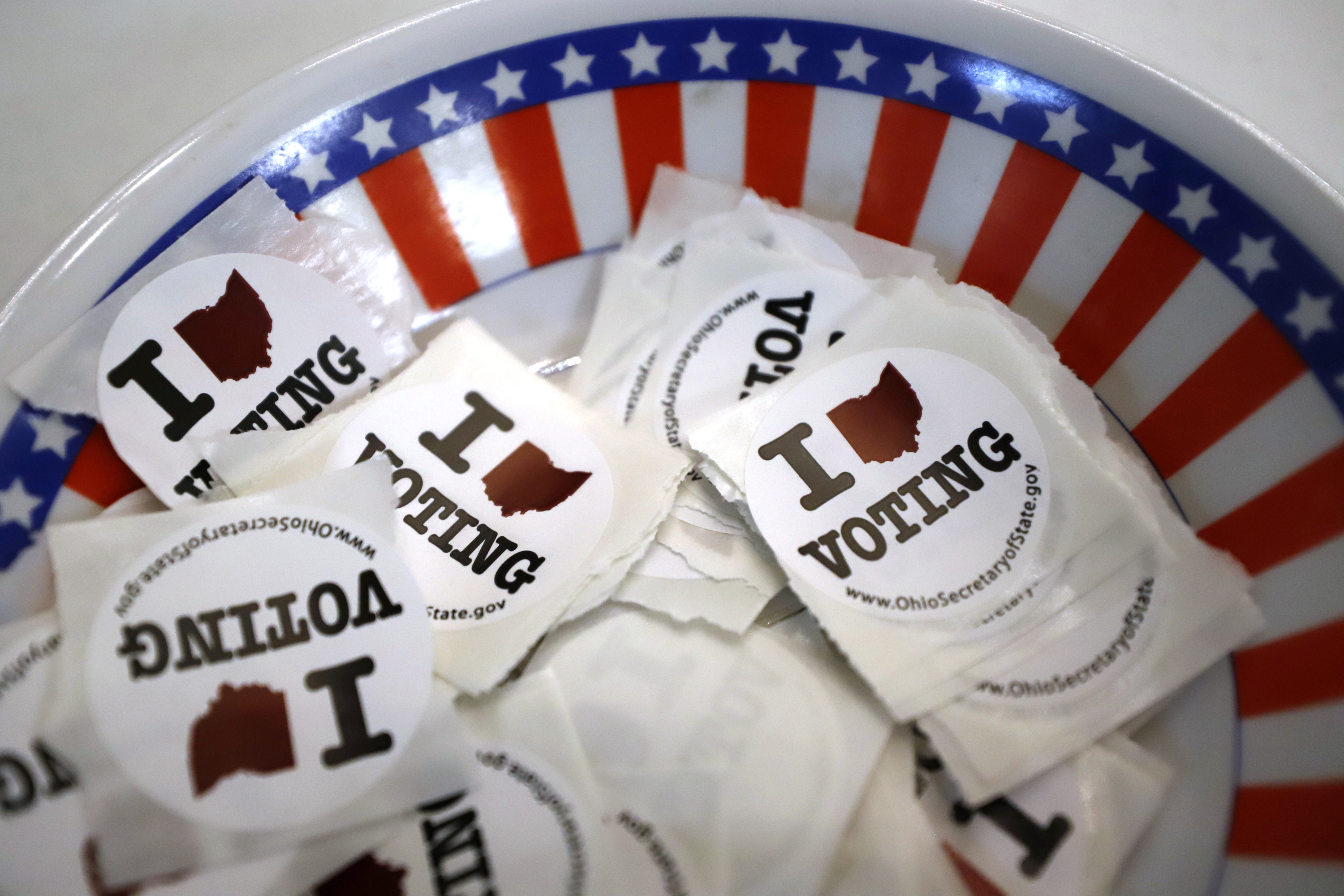 FILE - A is a bowl of voting stickers for early voters is shown March 15, 2020, in Steubenville, Ohio. A federal judge struck down restrictions Monday, July 22, 2024, in Ohio’s sweeping 2023 election law that voting rights groups said restricted people from helping voters with disabilities cast absentee ballots. (AP Photo/Gene J. Puskar, File)