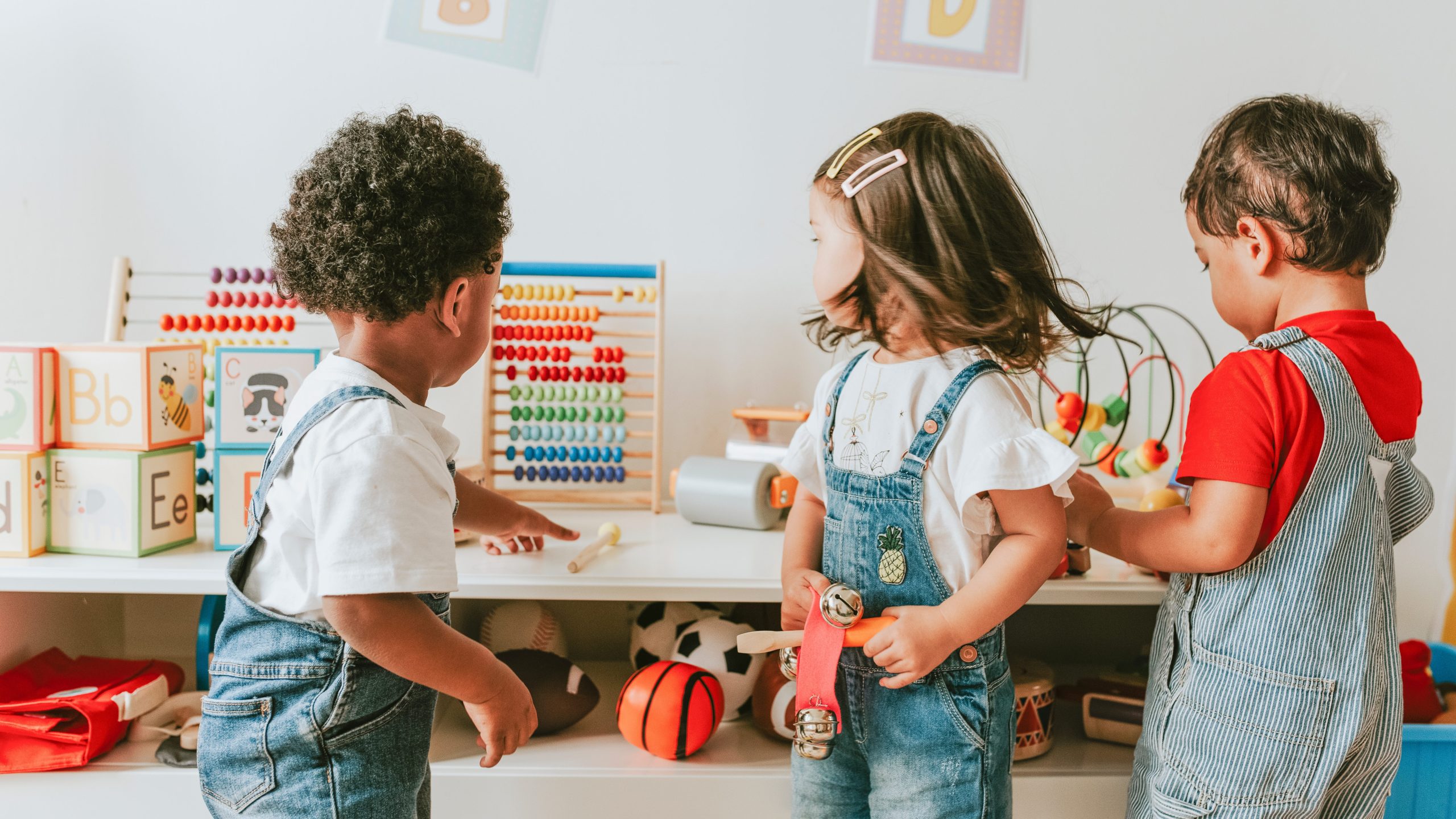 Young children playing with educational toys