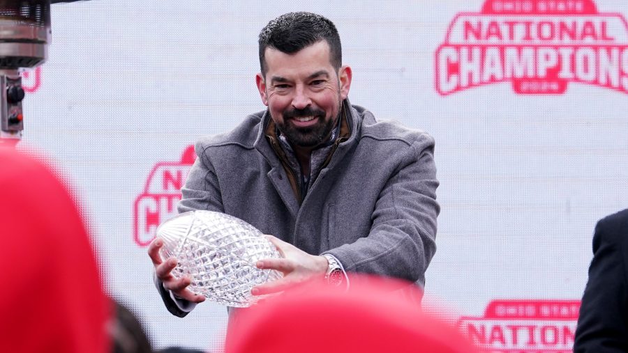 COLUMBUS, OHIO - JANUARY 26: Head coach Ryan Day of the Ohio State Buckeyes lifts The Coaches' Trophy during the NCAA Football Championship celebration at Ohio Stadium on January 26, 2025 in Columbus, Ohio. (Photo by Jason Mowry/Getty Images)