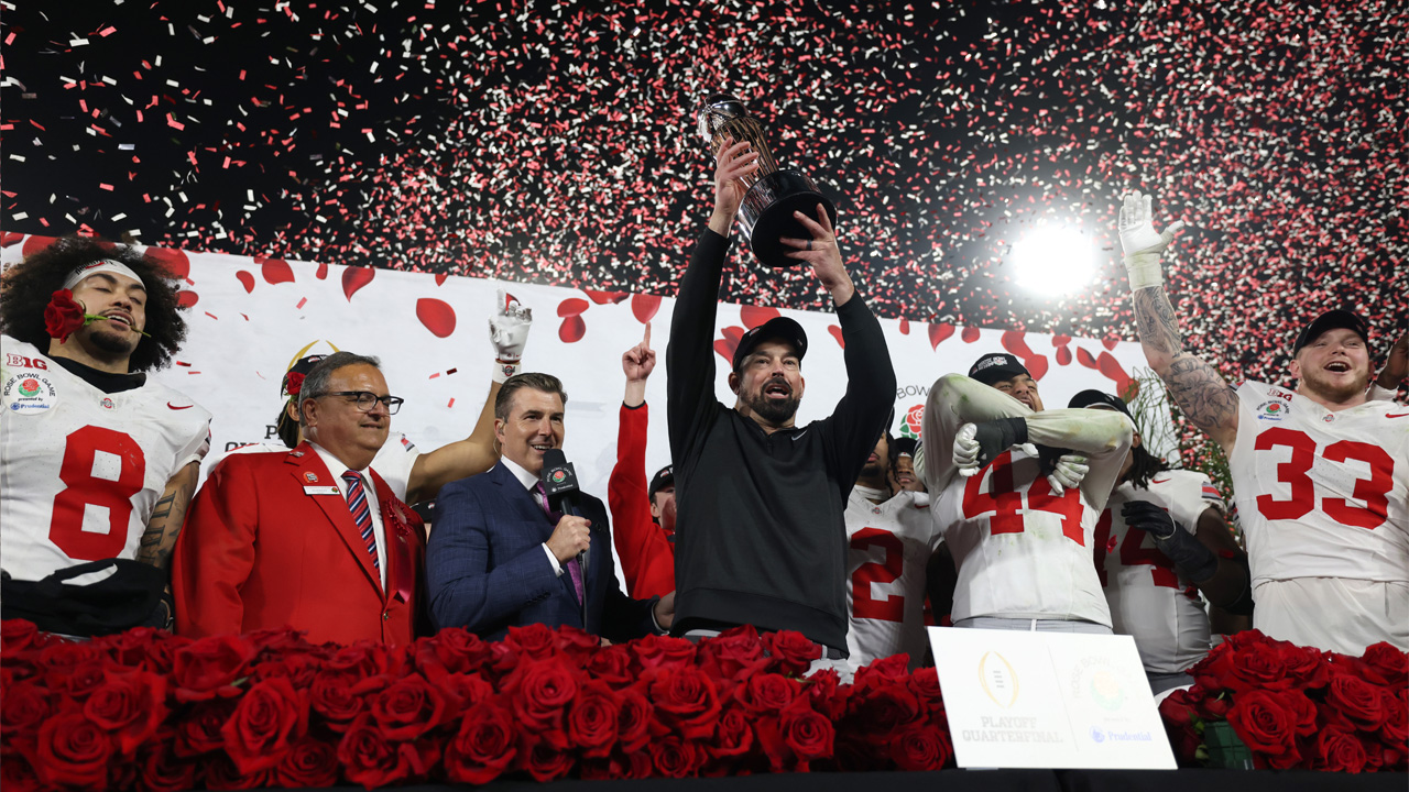 PASADENA, CALIFORNIA - JANUARY 01: head coach Ryan Day of the Ohio State Buckeyes holds up the The Leishman Trophy after defeating the Oregon Ducks 41-21 in the Rose Bowl Game Presented by Prudential at Rose Bowl Stadium on January 01, 2025 in Pasadena, California. (Photo by Harry How/Getty Images)