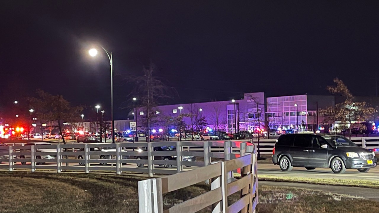 Cars line up along with law enforcement vehicles outside the KDC/One building in New Albany following a shooting Tuesday, Feb. 4, 2025. (NBC 4)