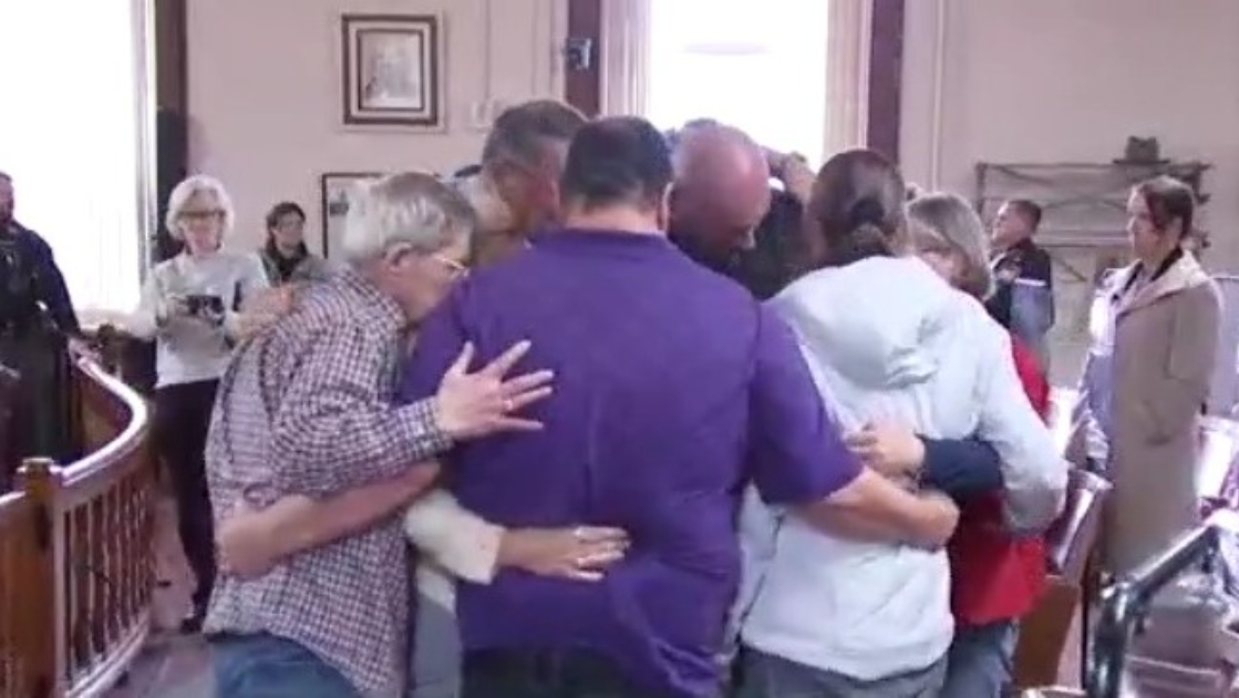 The family of Jo Ann Echelbarger shares a hug after a guilty verdict was reached in the fatal dog attack that took her life.