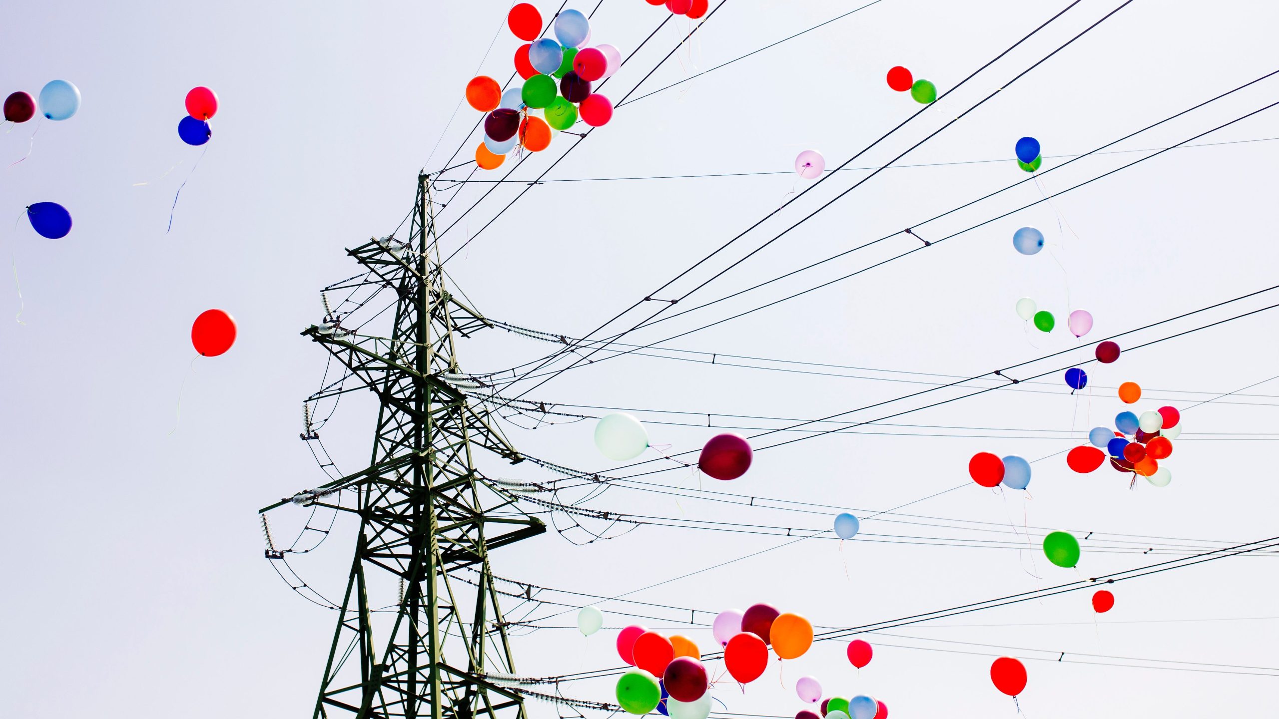 Colorful balloons Flying trough Electrical power lines