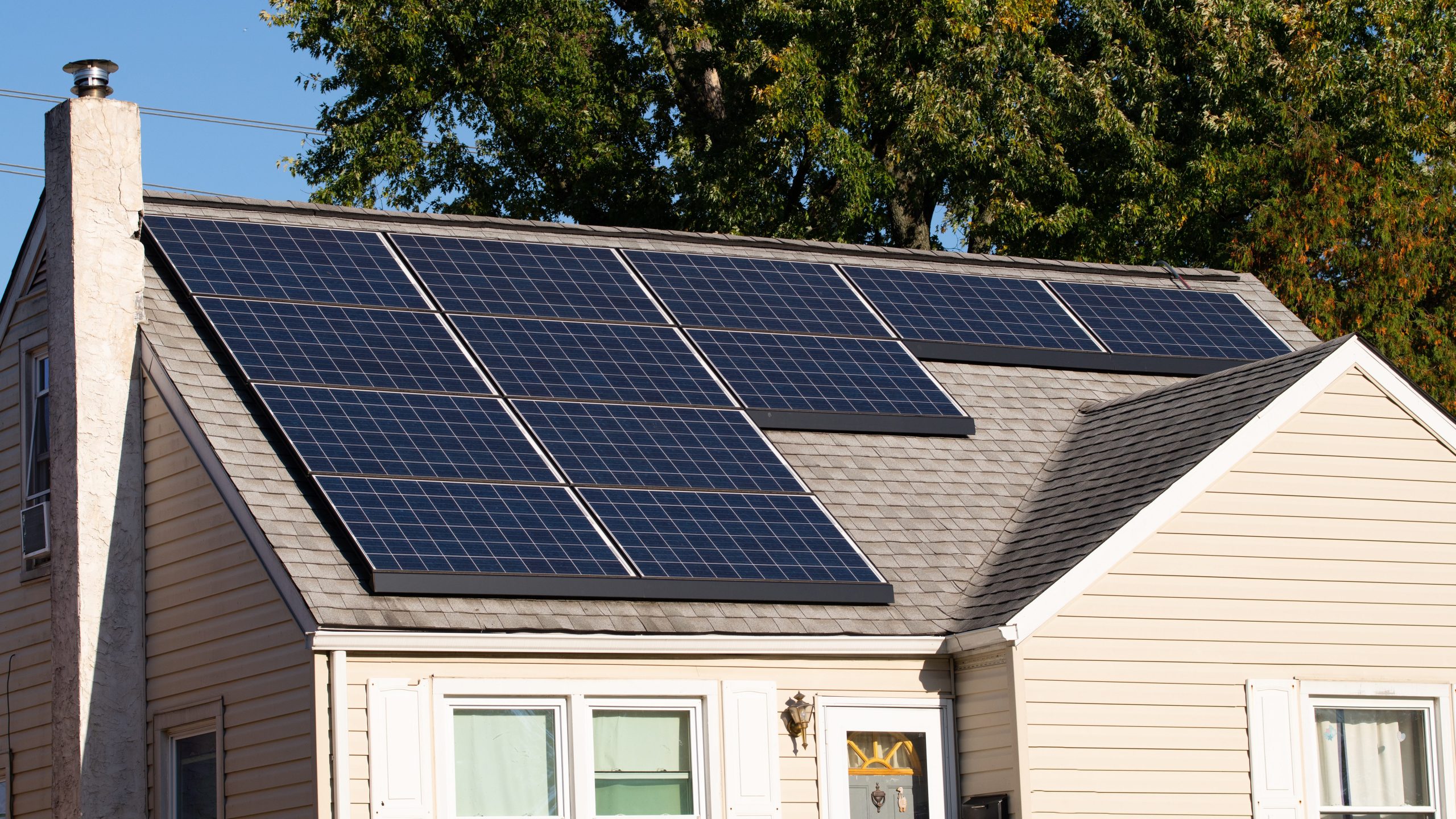 Solar photovoltaic panels on a house roof tehnology sky