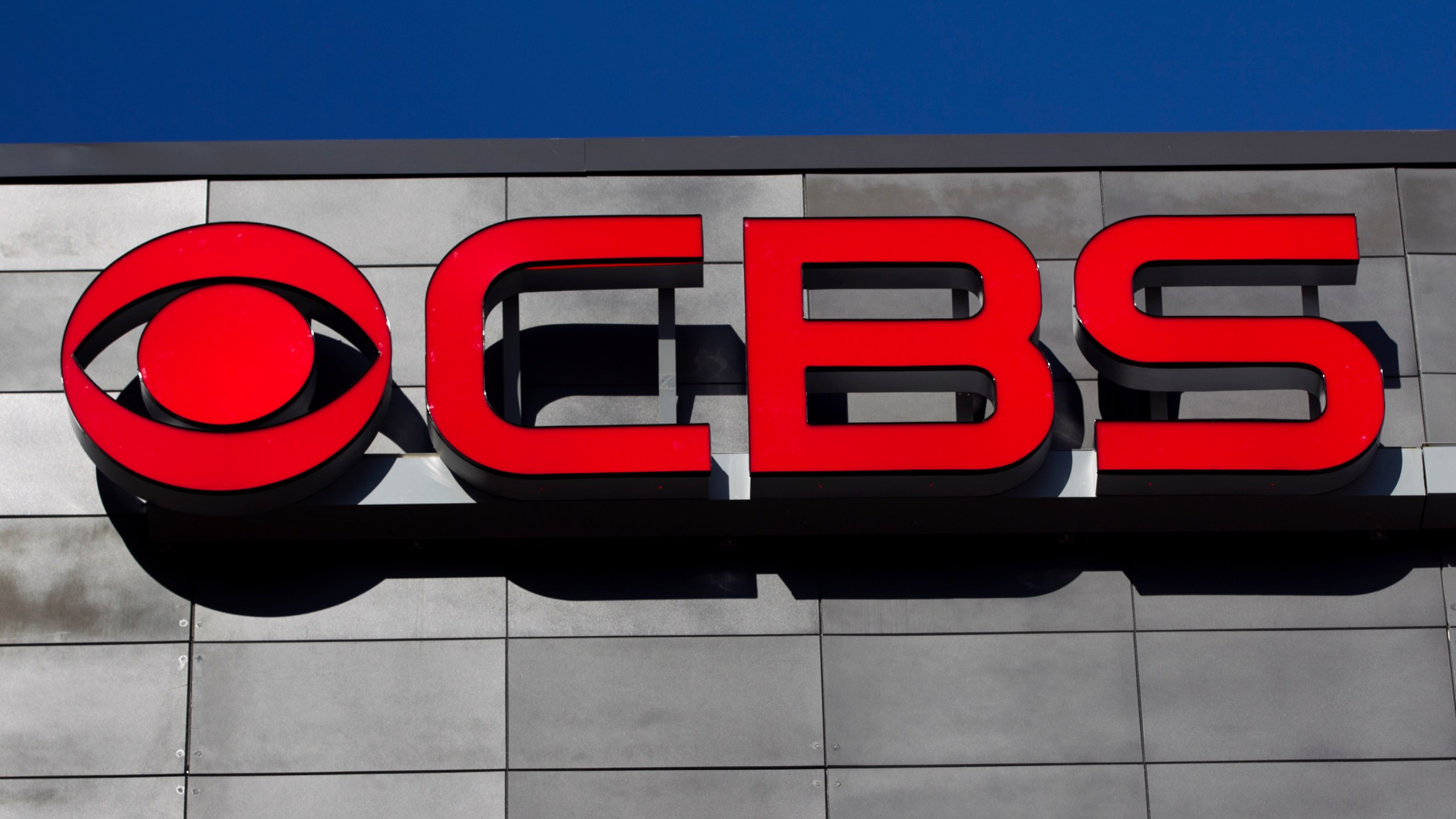 FILE - The CBS logo is displayed on the exterior of CBS Scene Restaurant and Bar, at Gillette Stadium, in Foxborough, Mass., Feb. 13, 2012. (AP Photo/Steven Senne, File)