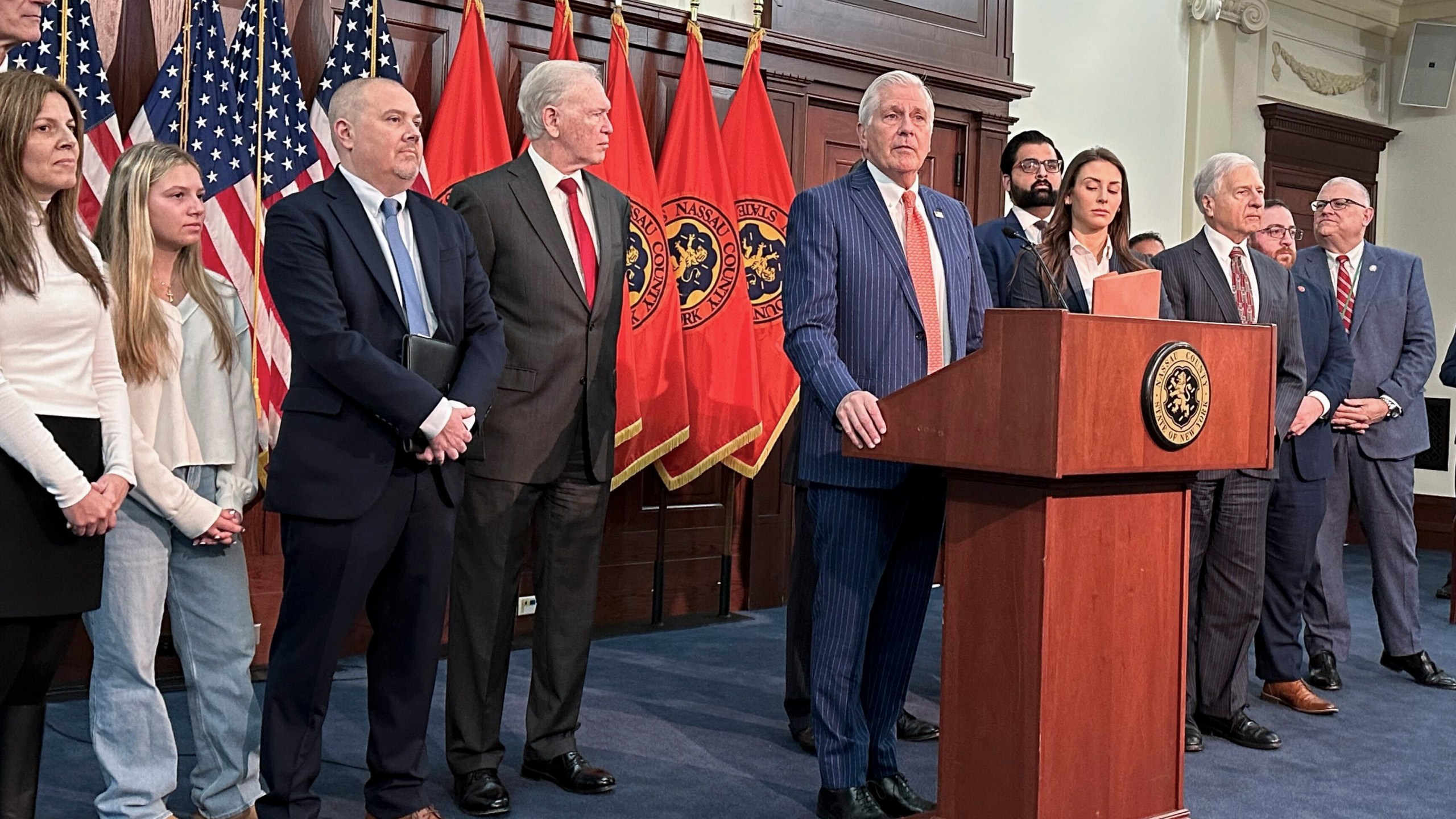 FILE - Nassau County Executive Bruce Blakeman, at podium, speaks during a news conference Wednesday, March 6, 2024, in Mineola, N.Y. (AP Photo/Philip Marcelo, File)