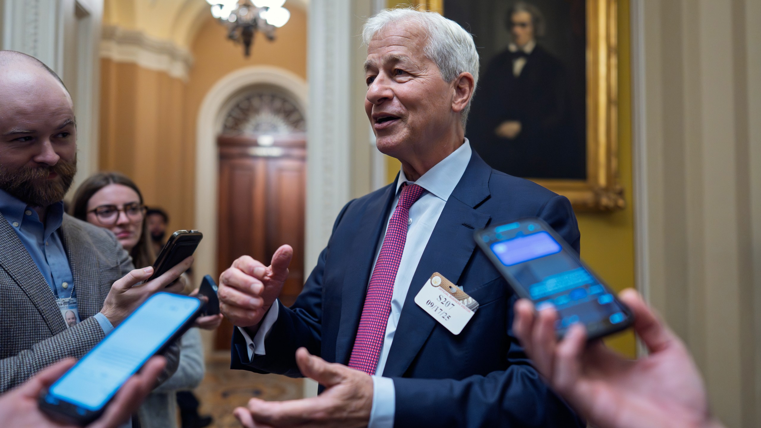 Jamie Dimon, CEO and chairman of JPMorgan Chase, pauses to talk to reporters after lunch with Republican senators to discuss the economy, at the Capitol in Washington, Wednesday, Sept. 17, 2025. (AP Photo/J. Scott Applewhite)