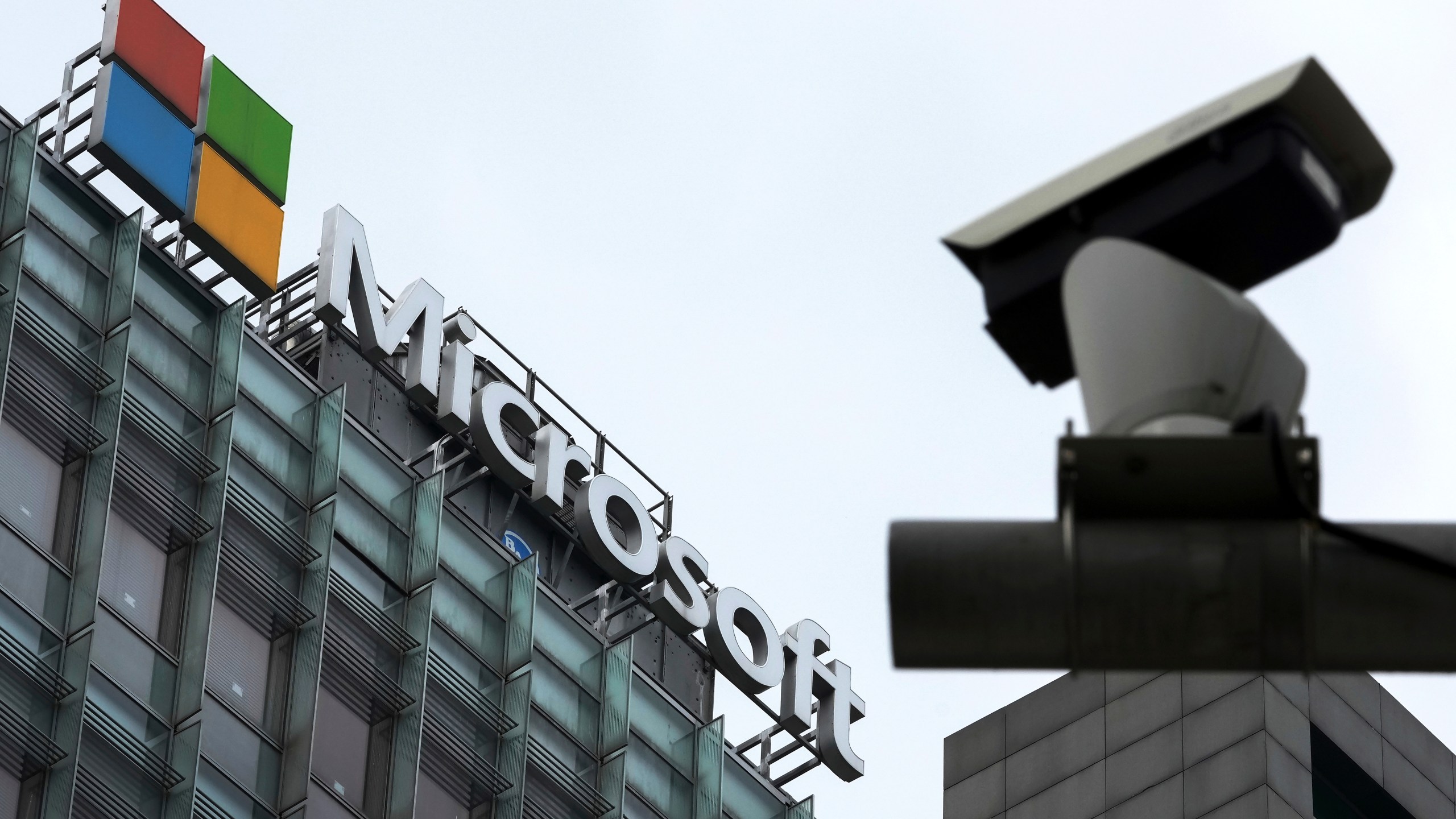 FILE - A security surveillance camera is seen near the Microsoft office building in Beijing, July 20, 2021. (AP Photo/Andy Wong, File)