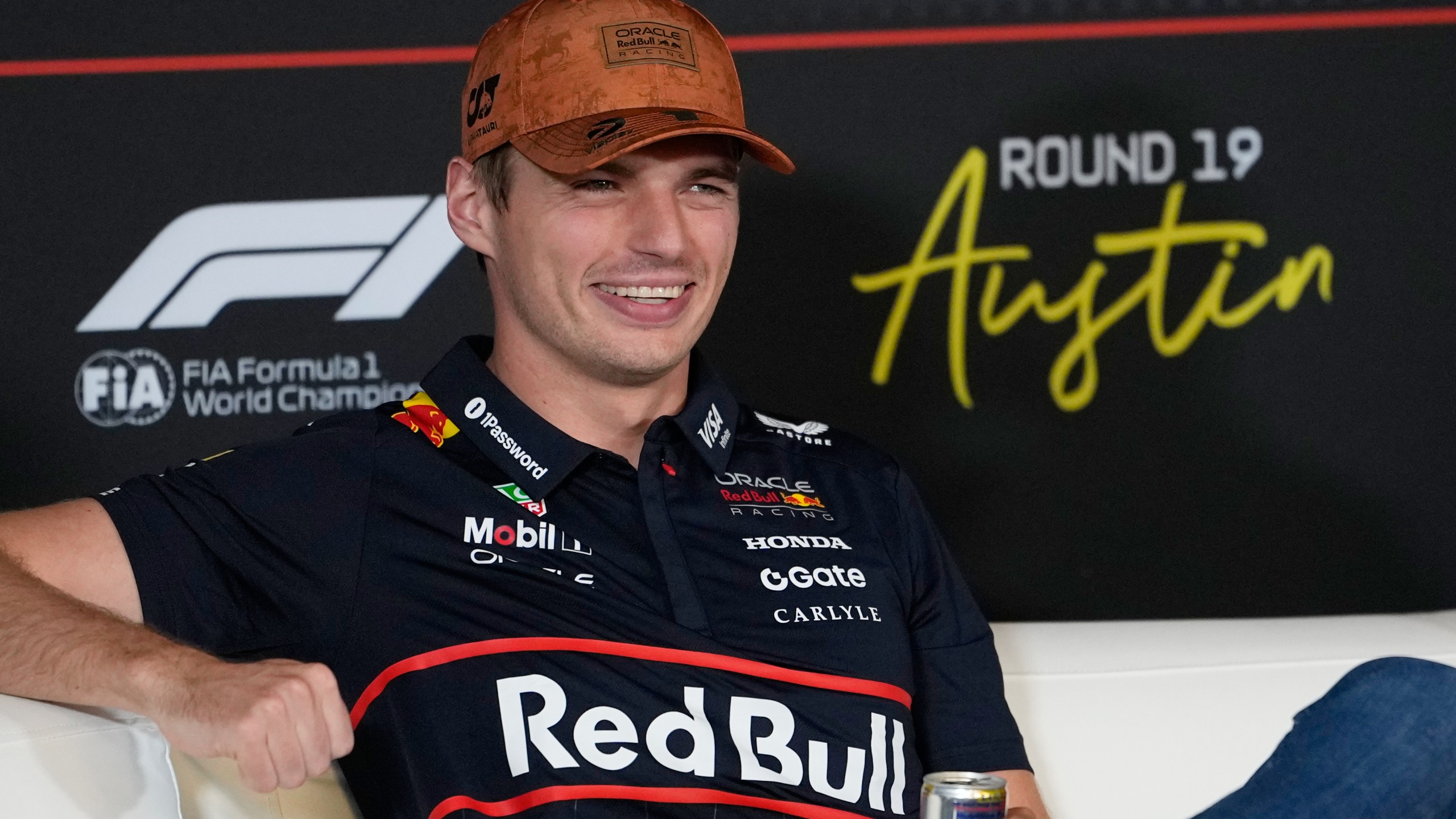 Red Bull driver Max Verstappen of the Netherlands smiles during a news conference for the Formula One U.S. Grand Prix auto race at the Circuit of the Americas, Thursday, Oct. 16, 2025, in Austin, Texas. (AP Photo/John Locher)