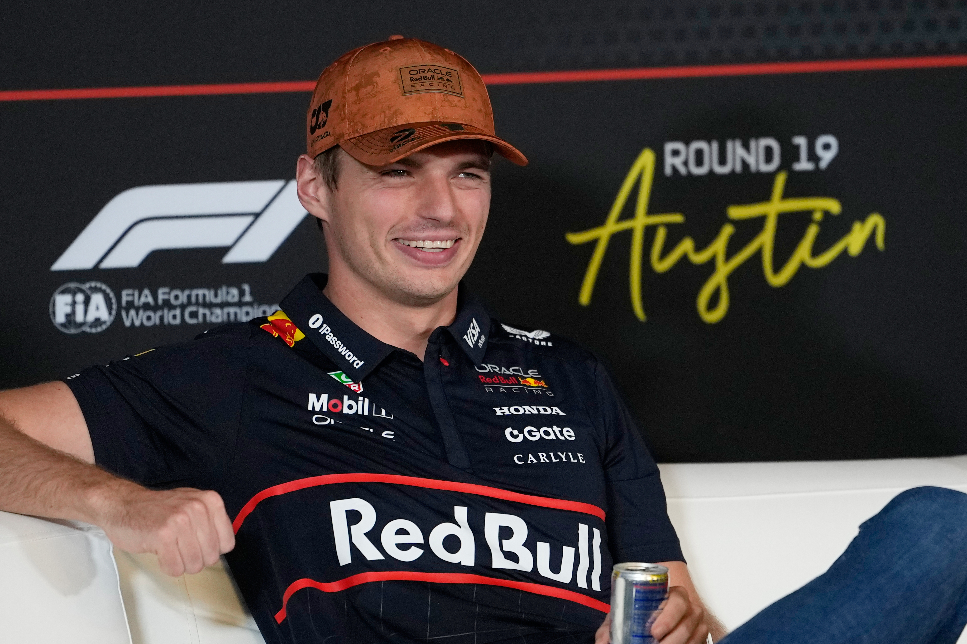 Red Bull driver Max Verstappen of the Netherlands smiles during a news conference for the Formula One U.S. Grand Prix auto race at the Circuit of the Americas, Thursday, Oct. 16, 2025, in Austin, Texas. (AP Photo/John Locher)