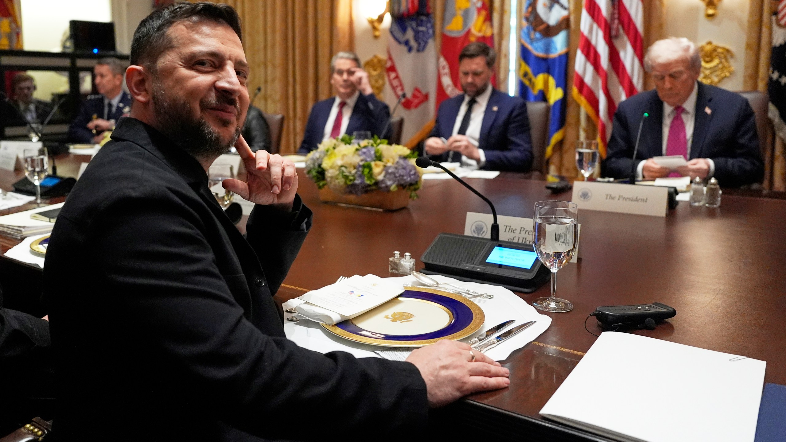 Ukraine's President Volodymyr Zelenskyy, left, sits before a meeting with President Donald Trump, from right, Vice President JD Vance and Treasury Secretary Scott Bessent in the Cabinet Room of the White House, Friday, Oct. 17, 2025, in Washington. (AP Photo/Alex Brandon)