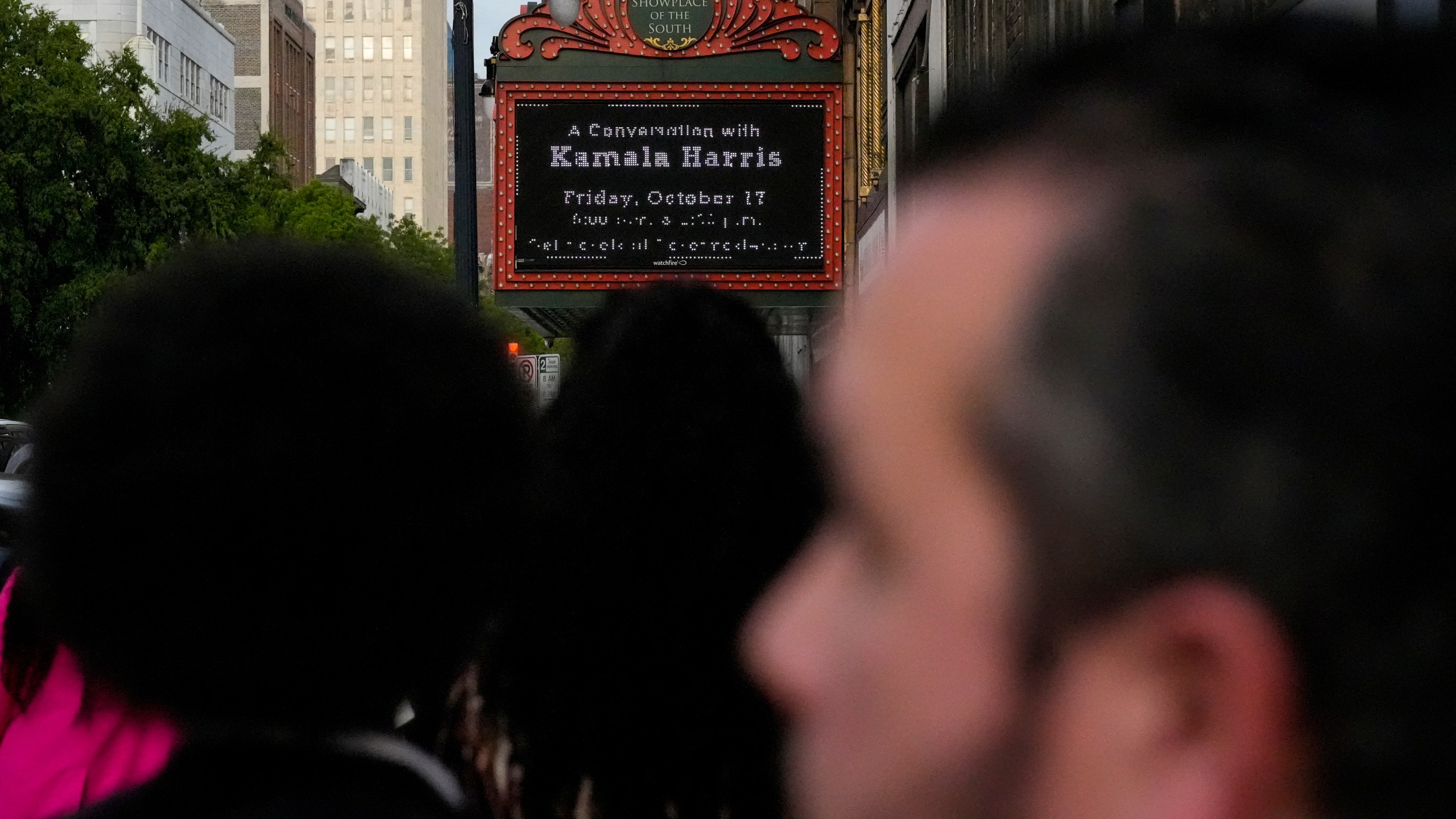 People wait in line to hear Former Vice President Kamala Harris speak about her new book, "107 Days," at an event Friday, Oct. 17, 2025, in Birmingham, Ala. (AP Photo/Mike Stewart)