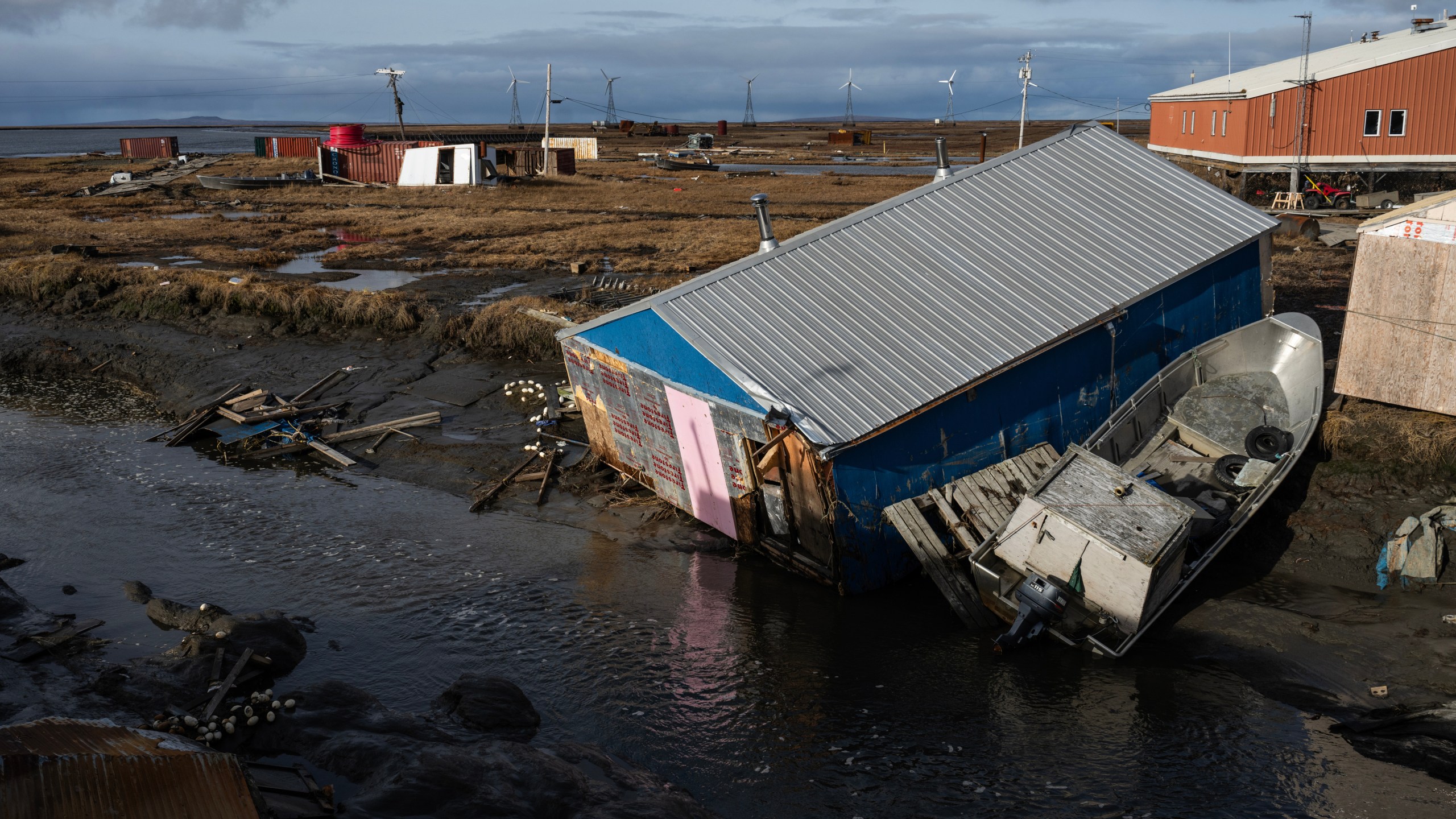 A home is left damaged in Kipnuk, Alaska, on a stream bank after the remnants of Typhoon Halong caused widespread destruction in the coastal village in Western Alaska, Friday, Oct. 17, 2025. (Marc Lester/Anchorage Daily News via AP)