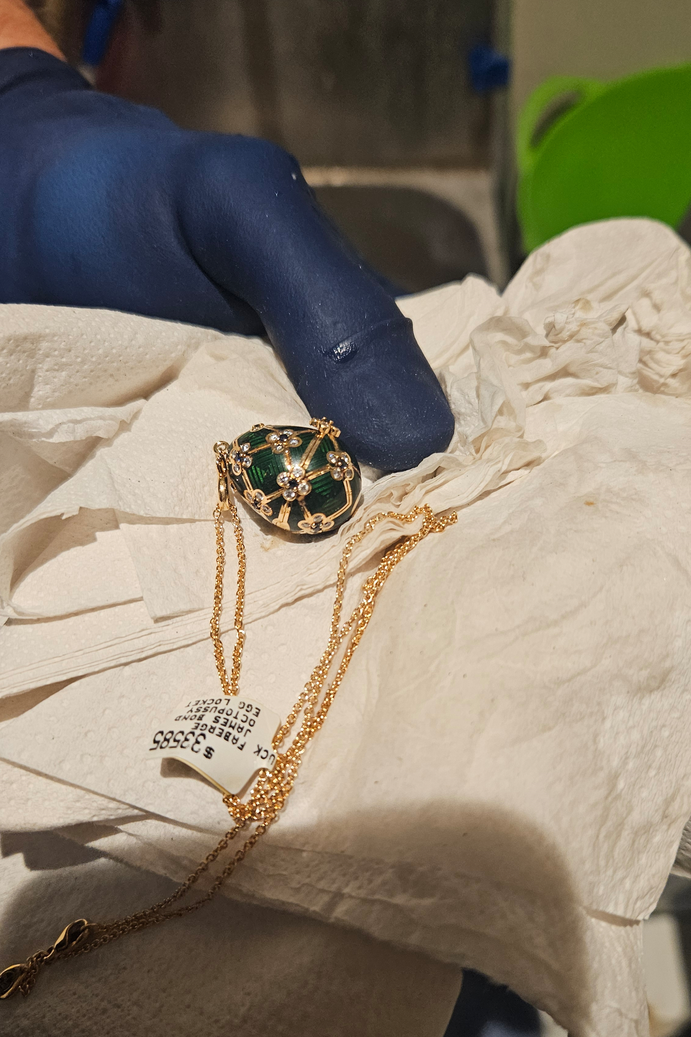 In this photo provided by the New Zealand Police a Fabergé pendant is held after it was recovered, Thursday, Dec. 4, 2025, from a man accused of stealing and swallowing the pendant. (New Zealand Police via AP)