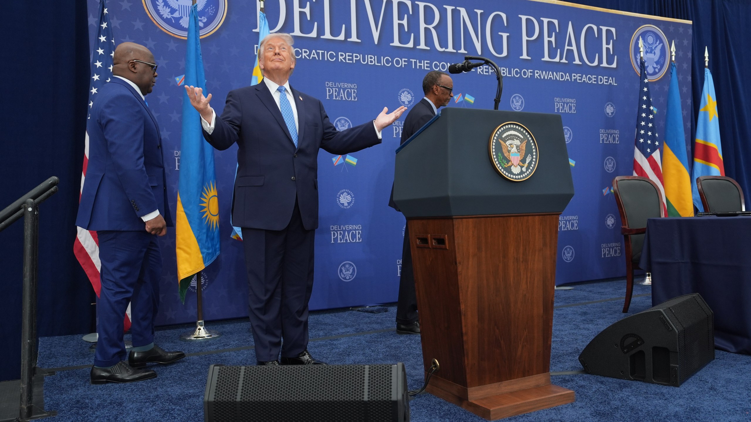 President Donald Trump arrives for a signing ceremony with Rwanda's President Paul Kagame and Democratic Republic of Congo President Felix-Antoine Tshisekedi at the U.S. Institute of Peace, Thursday, Dec. 4, 2025, in Washington. (AP Photo/Evan Vucci)