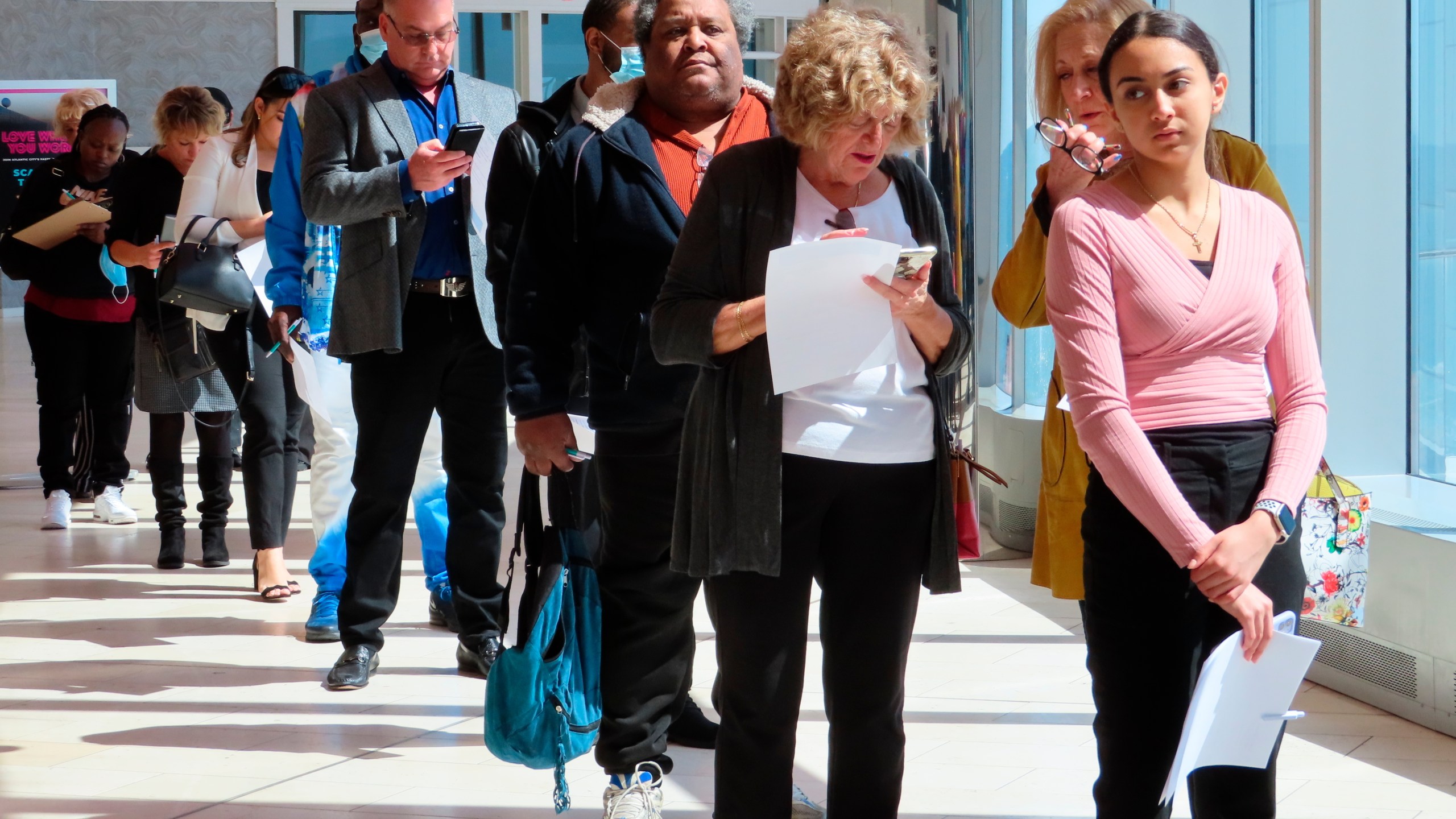 FILE - Applicants line up at a job fair at the Ocean Casino Resort in Atlantic City N.J., on April 11, 2022. (AP Photo/Wayne Parry, File)