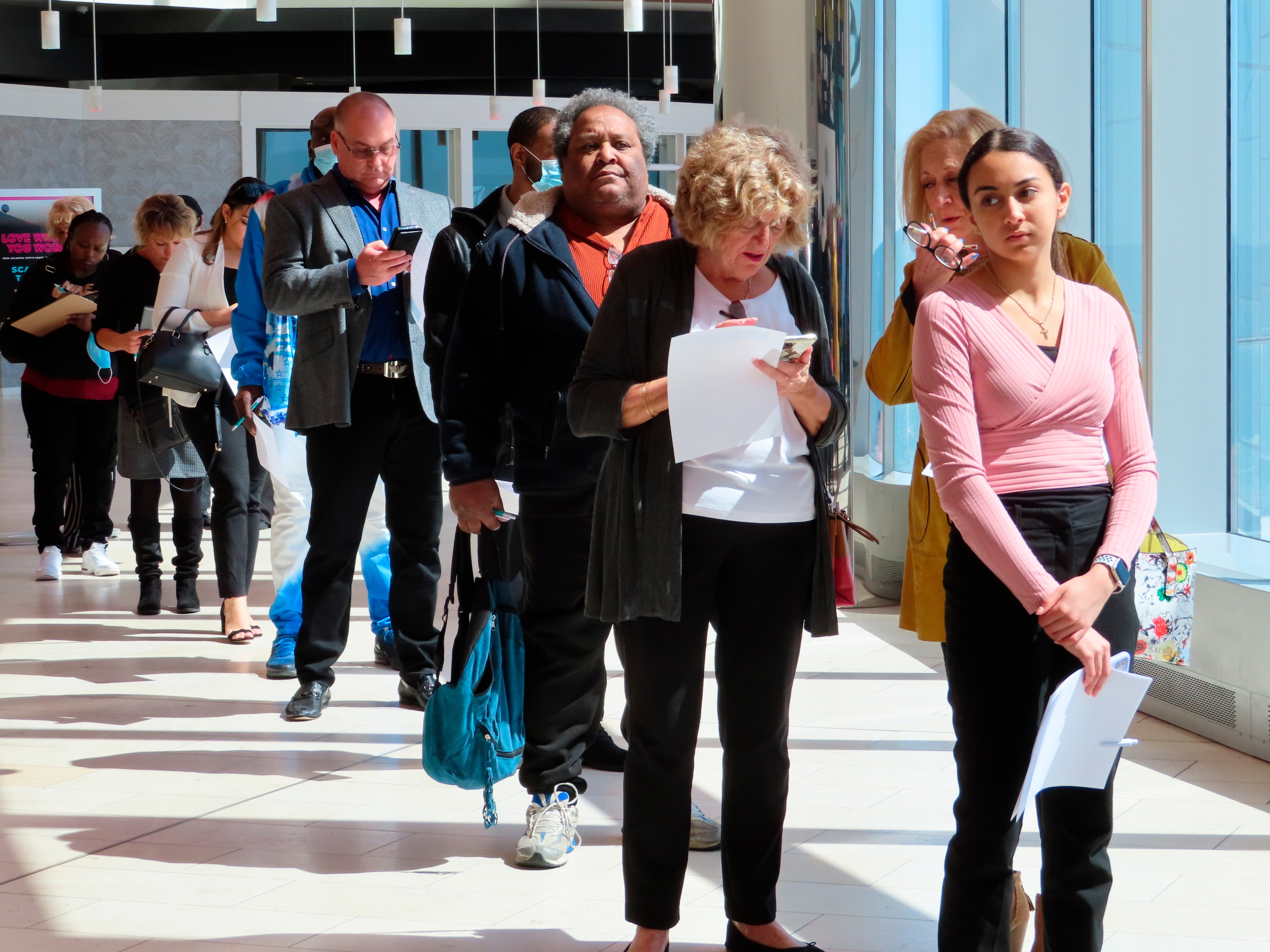 FILE - Applicants line up at a job fair at the Ocean Casino Resort in Atlantic City N.J., on April 11, 2022. (AP Photo/Wayne Parry, File)