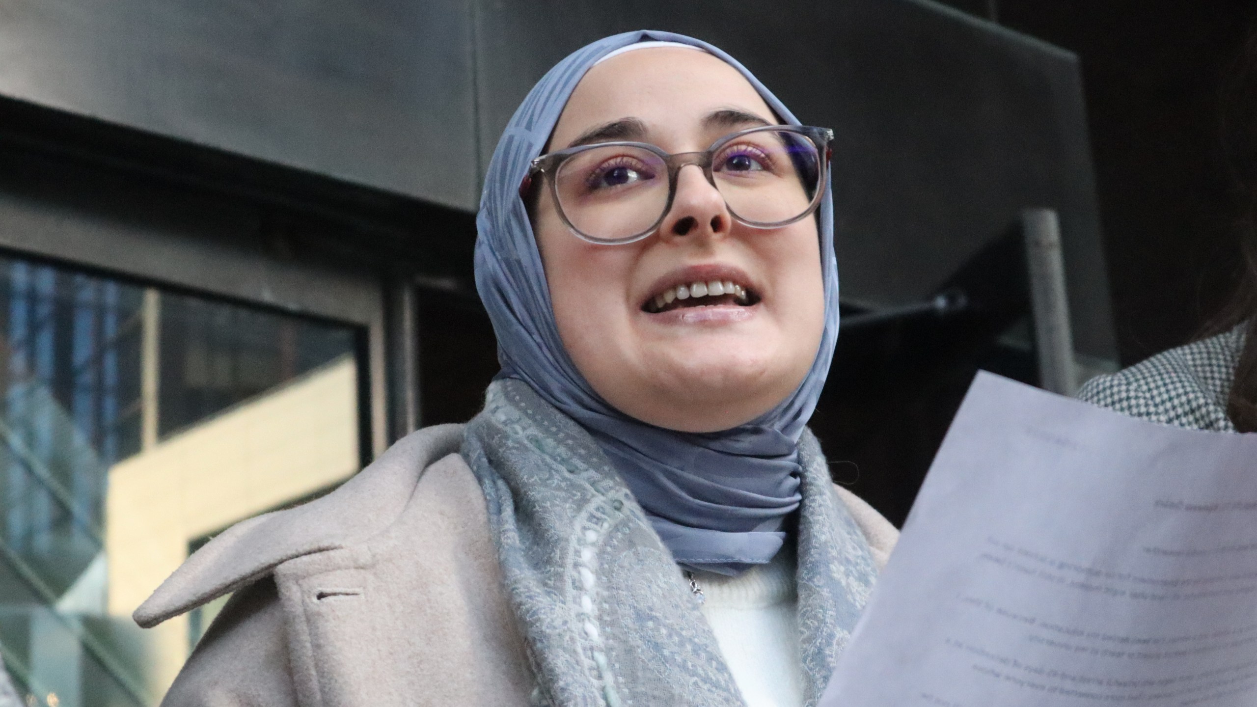 Tufts University doctoral student Rumeysa Ozturk reads from a prepared statement following a court hearing outside the John Joseph Moakley United States Courthouse Thursday, Dec. 4, 2025, in Boston. (AP Photo/Leah Willingham)