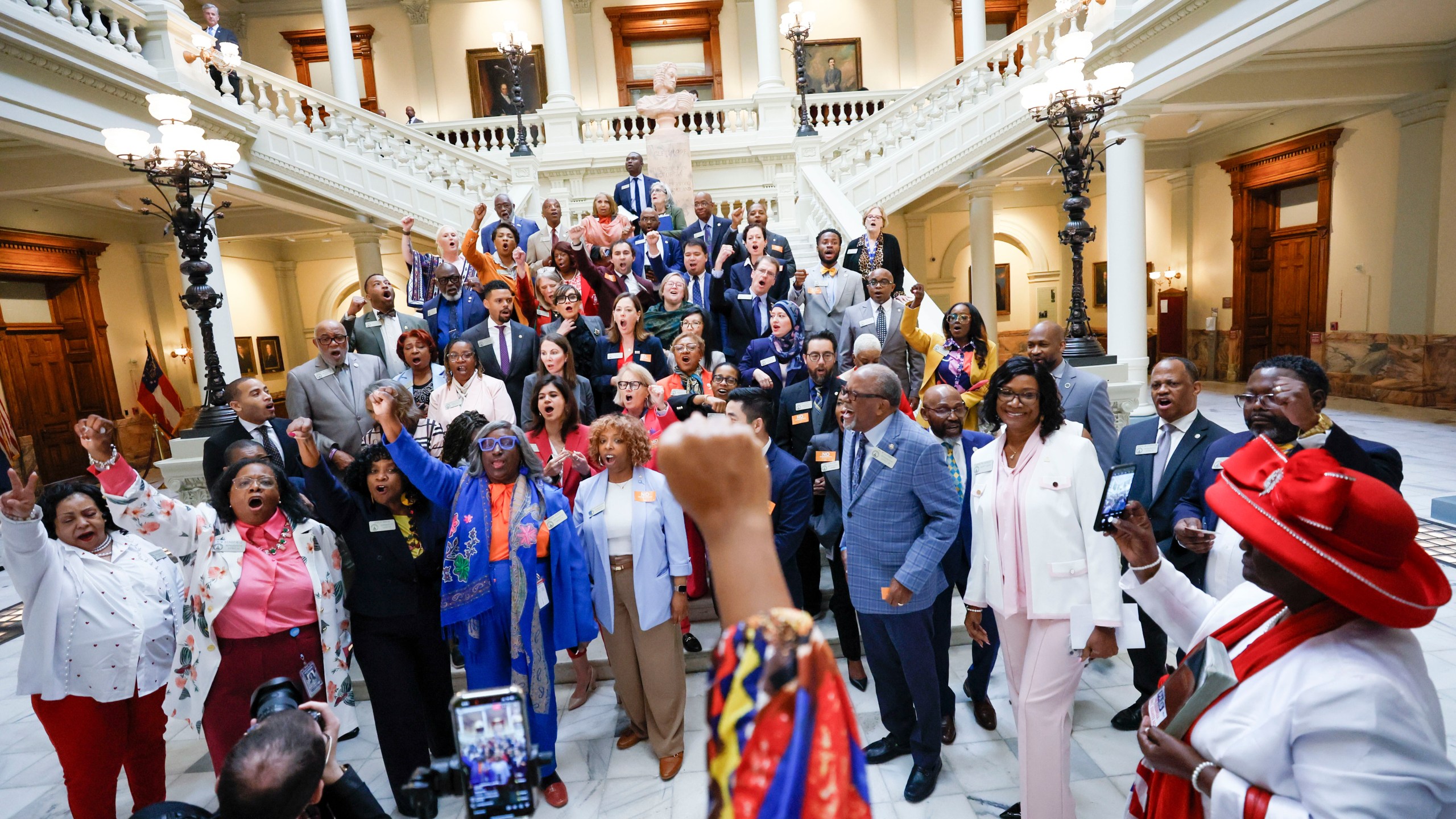 FILE - Georgia House Democrats walk out of the House Chamber in protest, after Senate Bill 185, which would outlaw spending on gender affirming care for transgender prisoners, was introduced at the state Capitol, April 2, 2025, in Atlanta. (Miguel Martinez/Atlanta Journal-Constitution via AP, File)